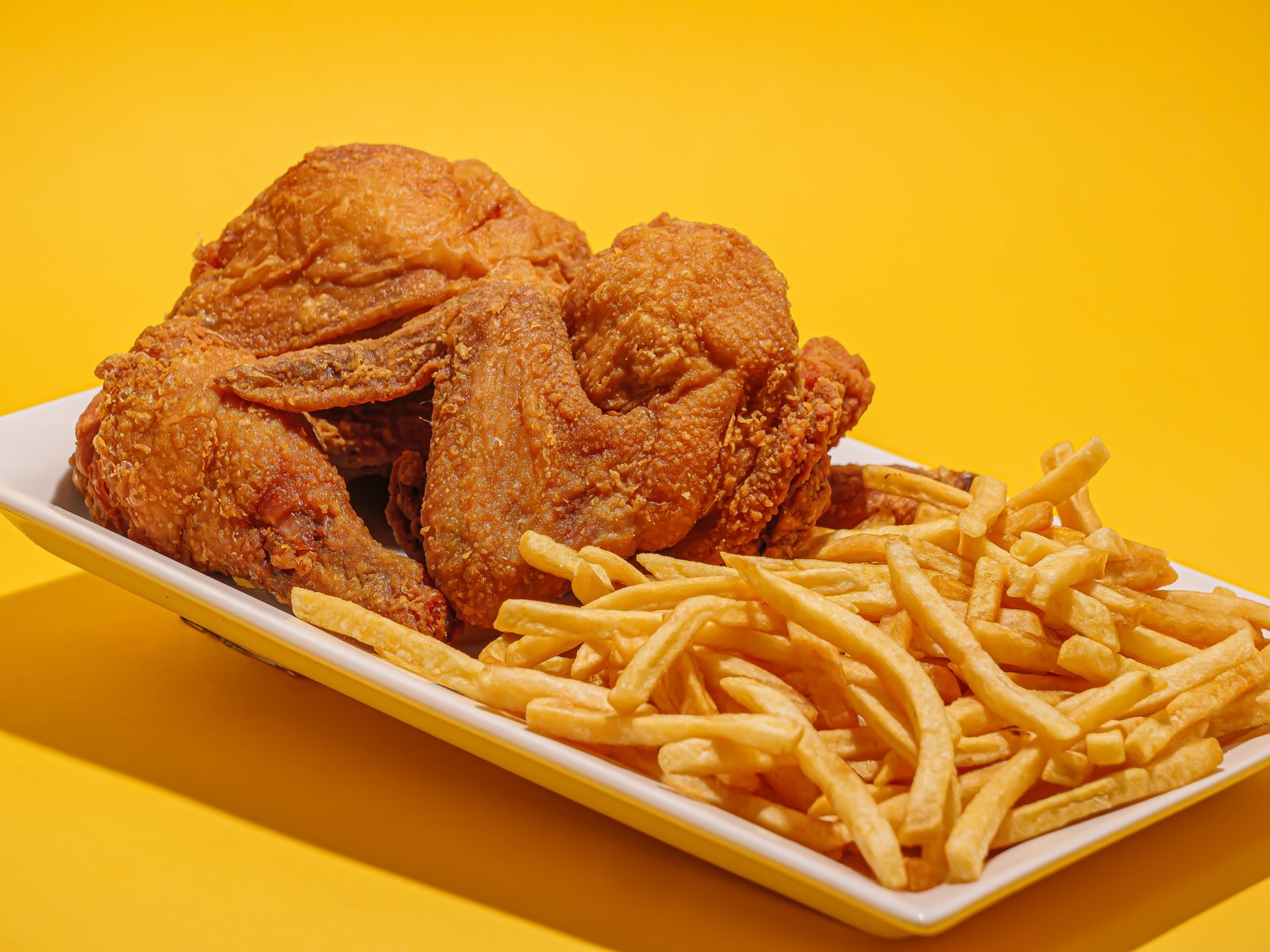 Golden fried chicken and fries, a home-style plate from retro Disney recipes