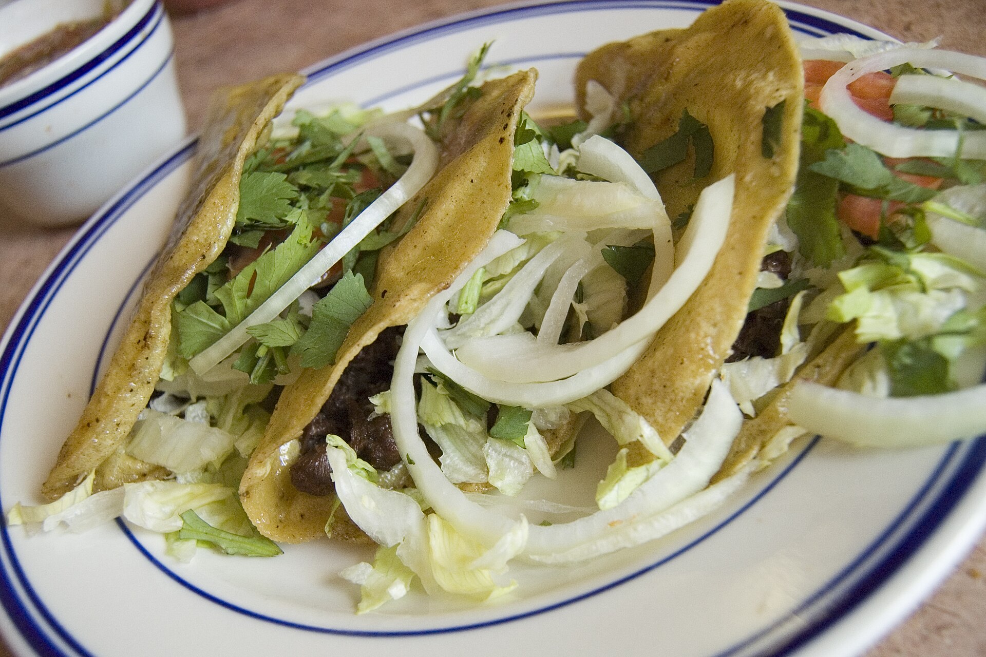 Crispy beef tacos with onion and cilantro, one of the most loved retro Disney recipes to make at home