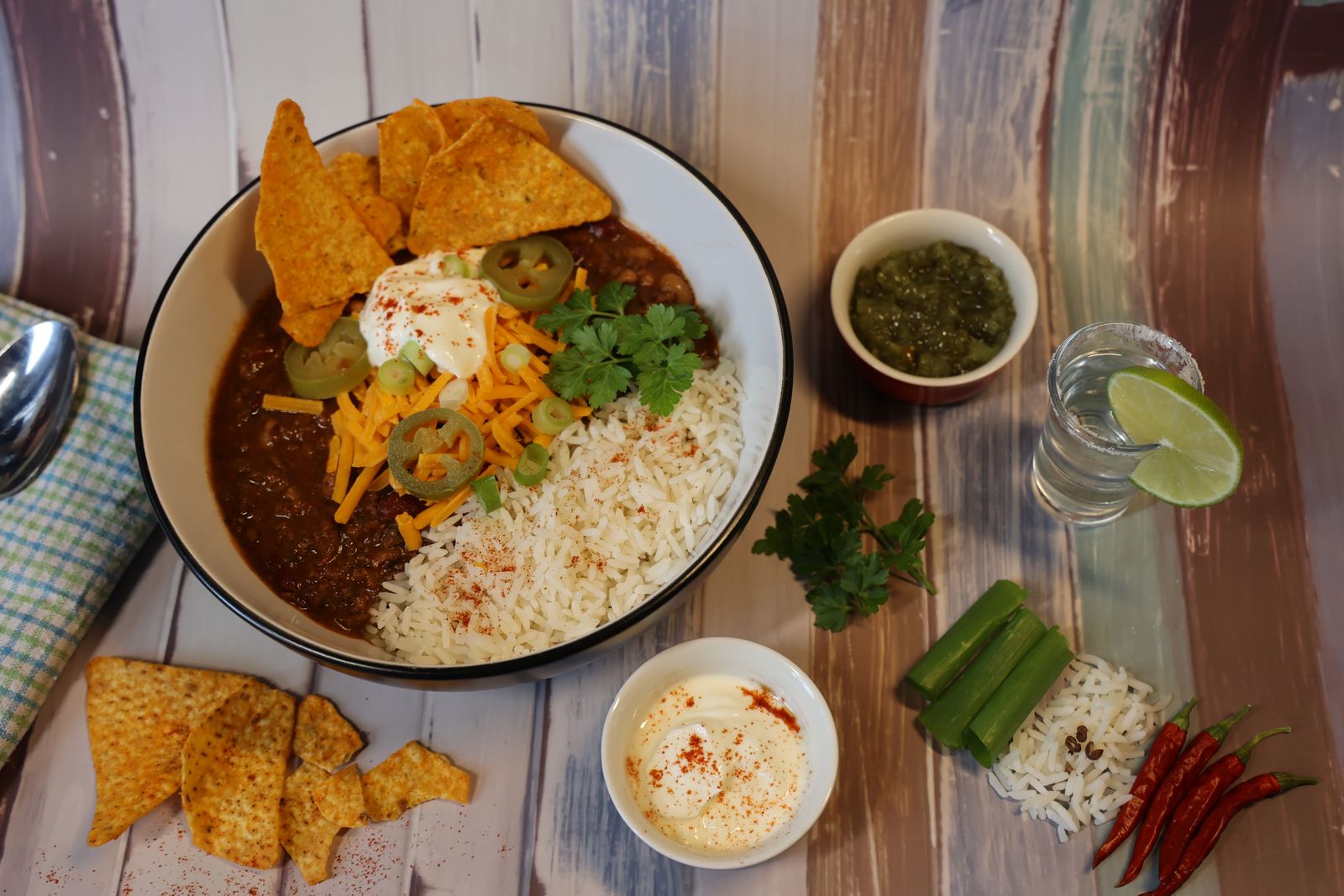 Bowl of turkey chili with toppings and tortilla chips