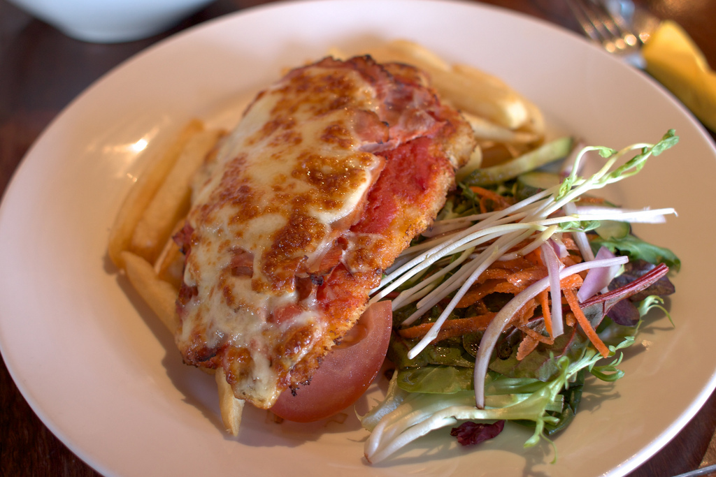 Chicken parmigiana with melted cheese and tomato sauce, one of the most watched Emeril Lagasse recipes