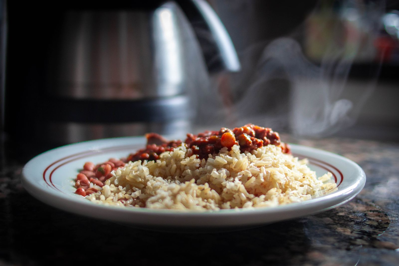 Red beans and rice on a white plate, a Monday classic from Emeril Lagasse recipes