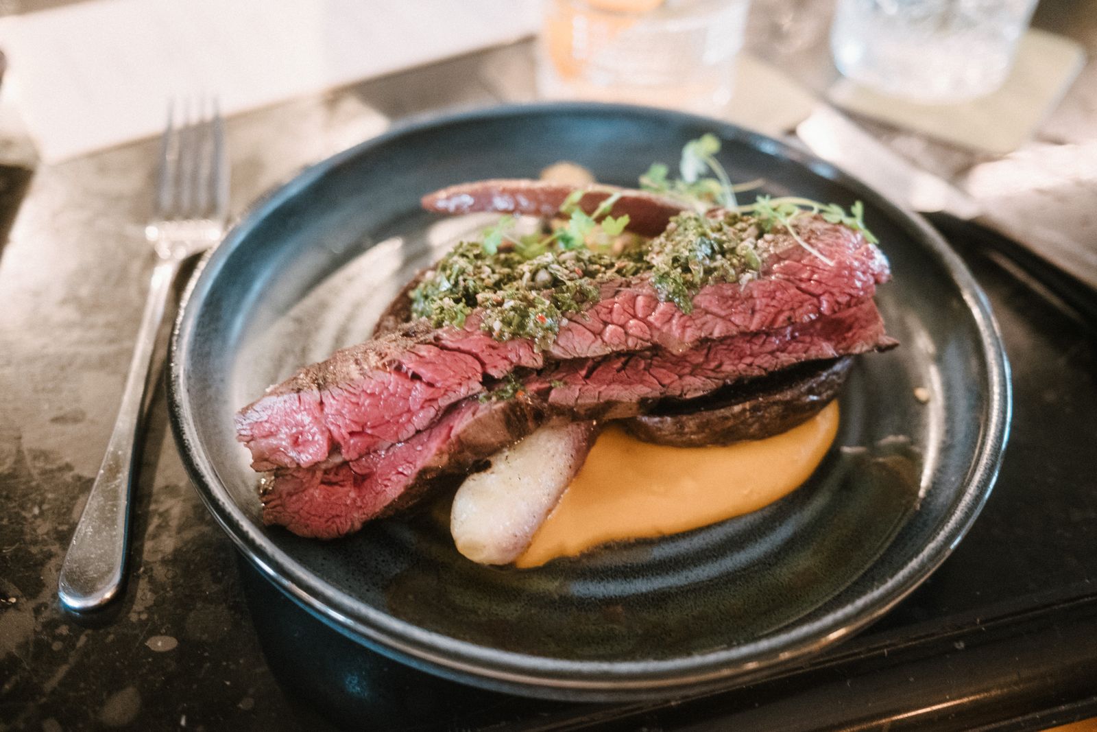 Sliced steak with chimichurri sauce