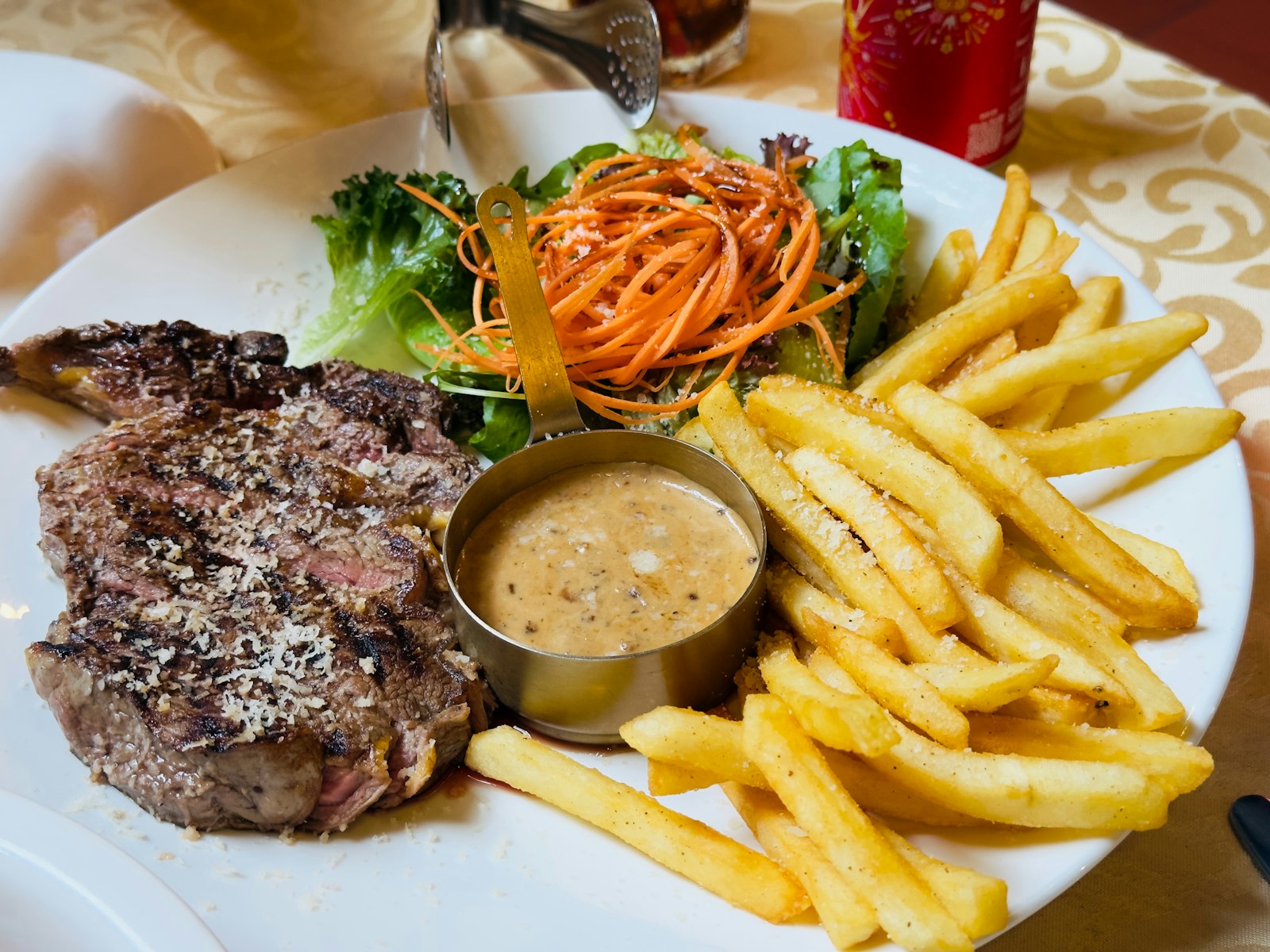 Steak frites with pepper sauce, a steak and potato dinner classic