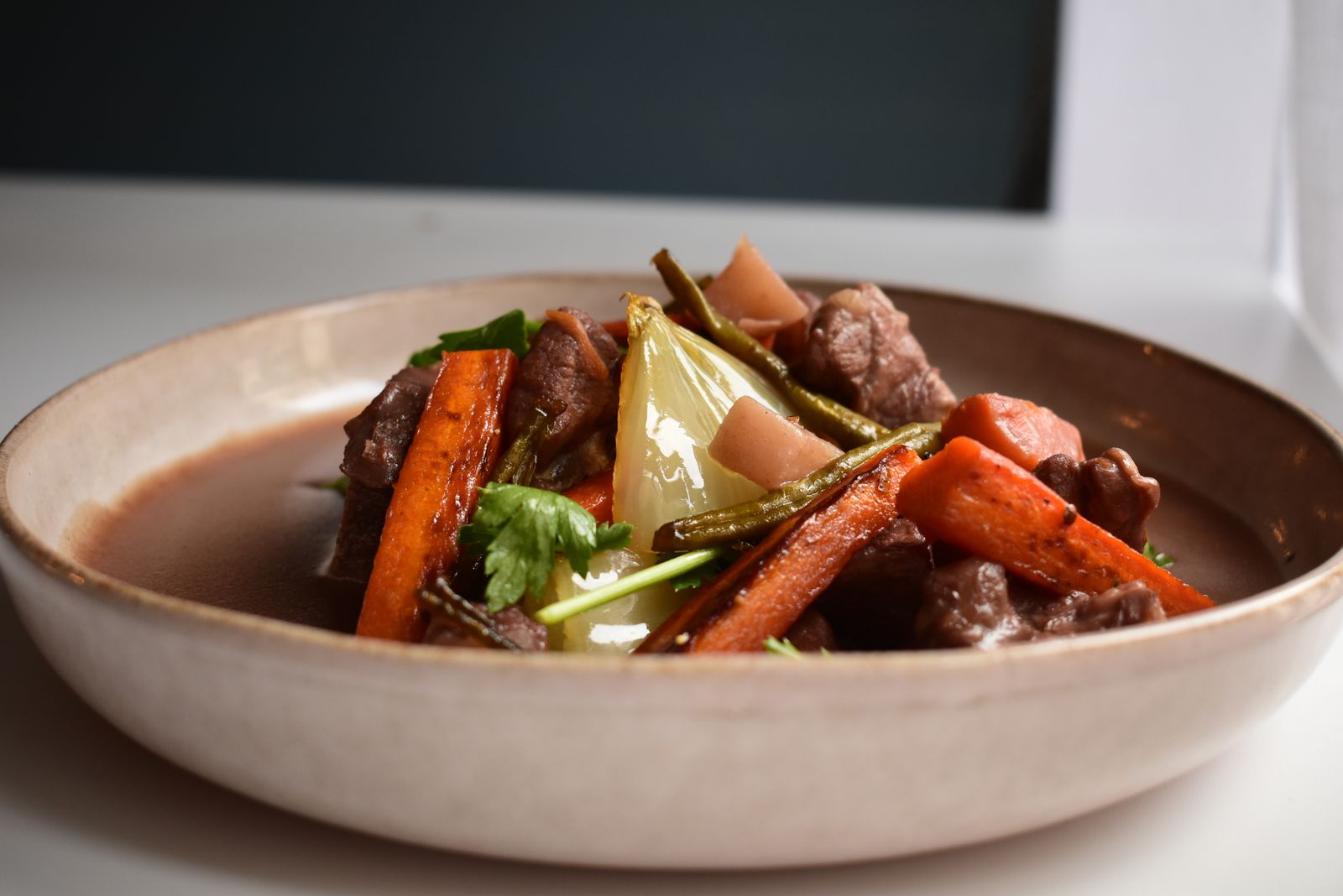 Slow cooked steak and potato dinner with carrots