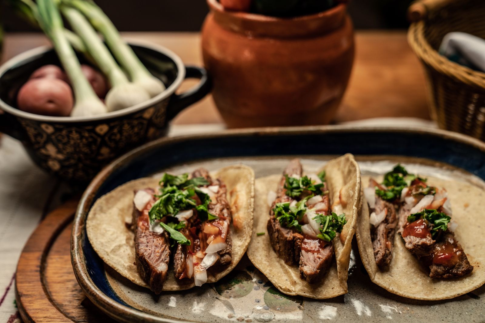Beef tacos with cilantro on corn tortillas