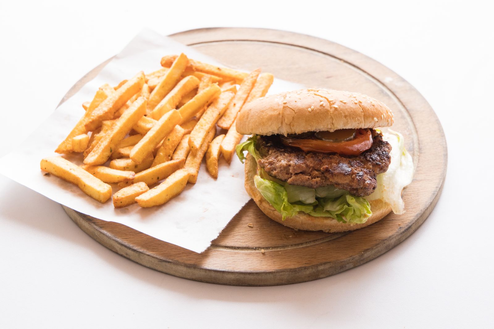 Diner cheeseburger and fries on a wooden board, a classic in Gilmore Girls recipes