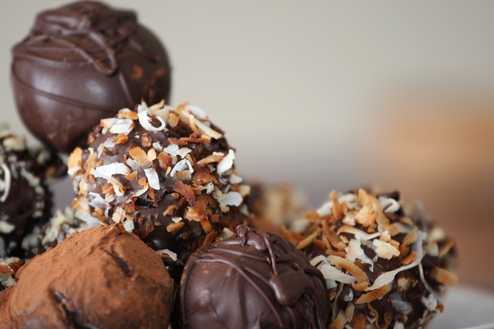 Chocolate truffles rolled in nuts, coconut and cocoa