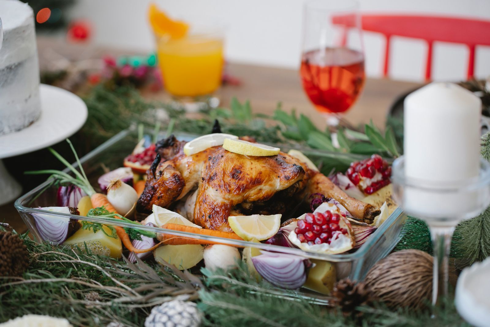 Roast chicken with vegetables in a glass dish, for a small Jamie Oliver Christmas table