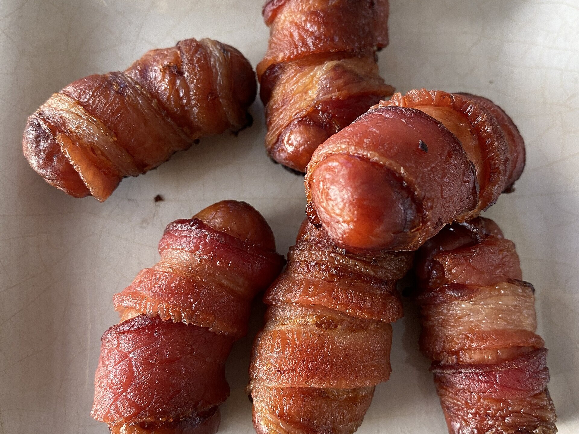 Pigs in blankets, small sausages wrapped in crispy bacon