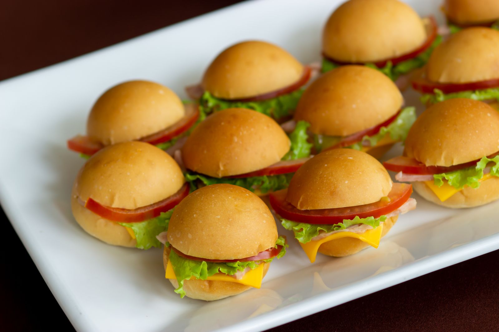 Platter of mini sliders on soft buns