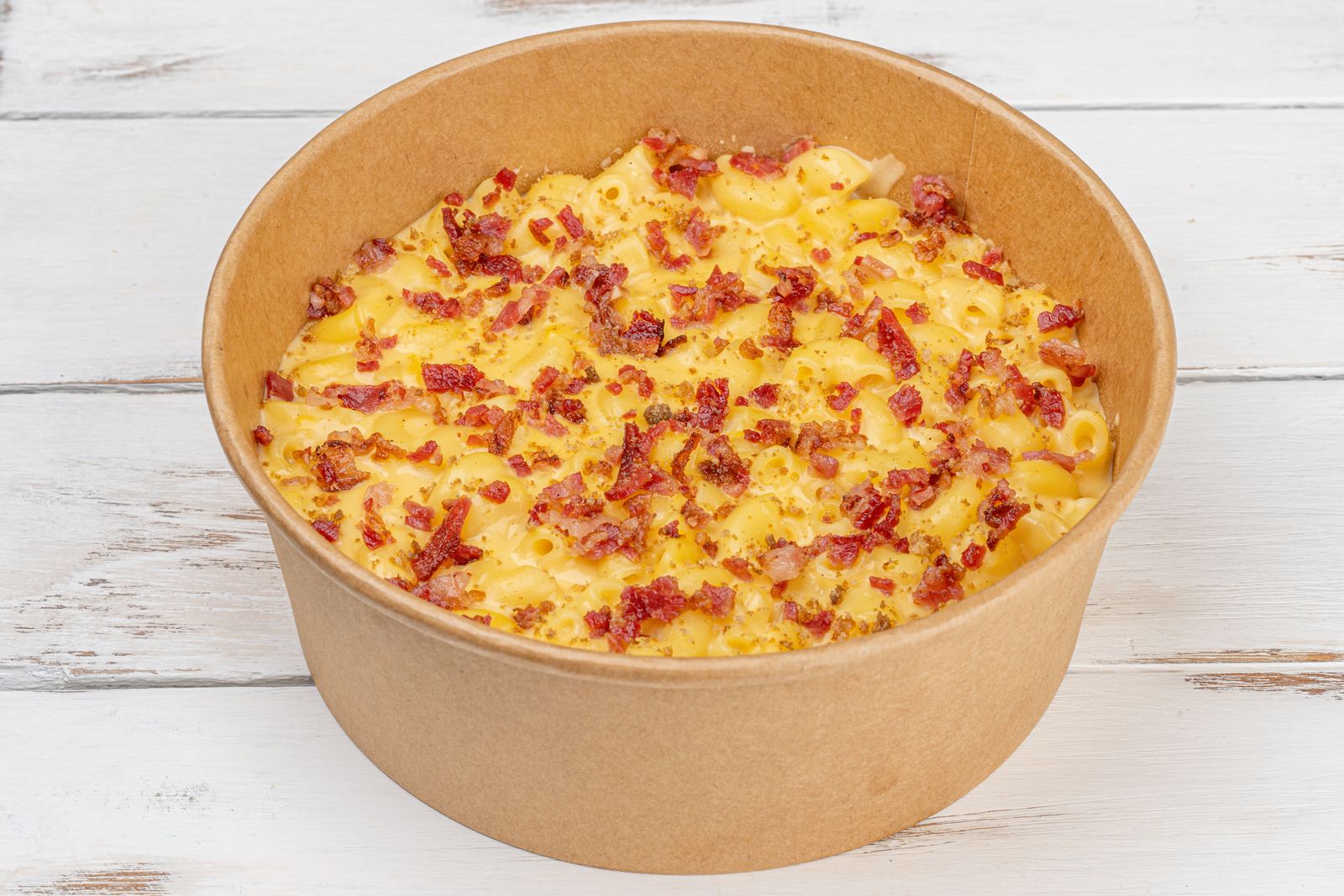 Baked mac and cheese with bits of green chile and bacon, one of the easiest Texas Thanksgiving recipes