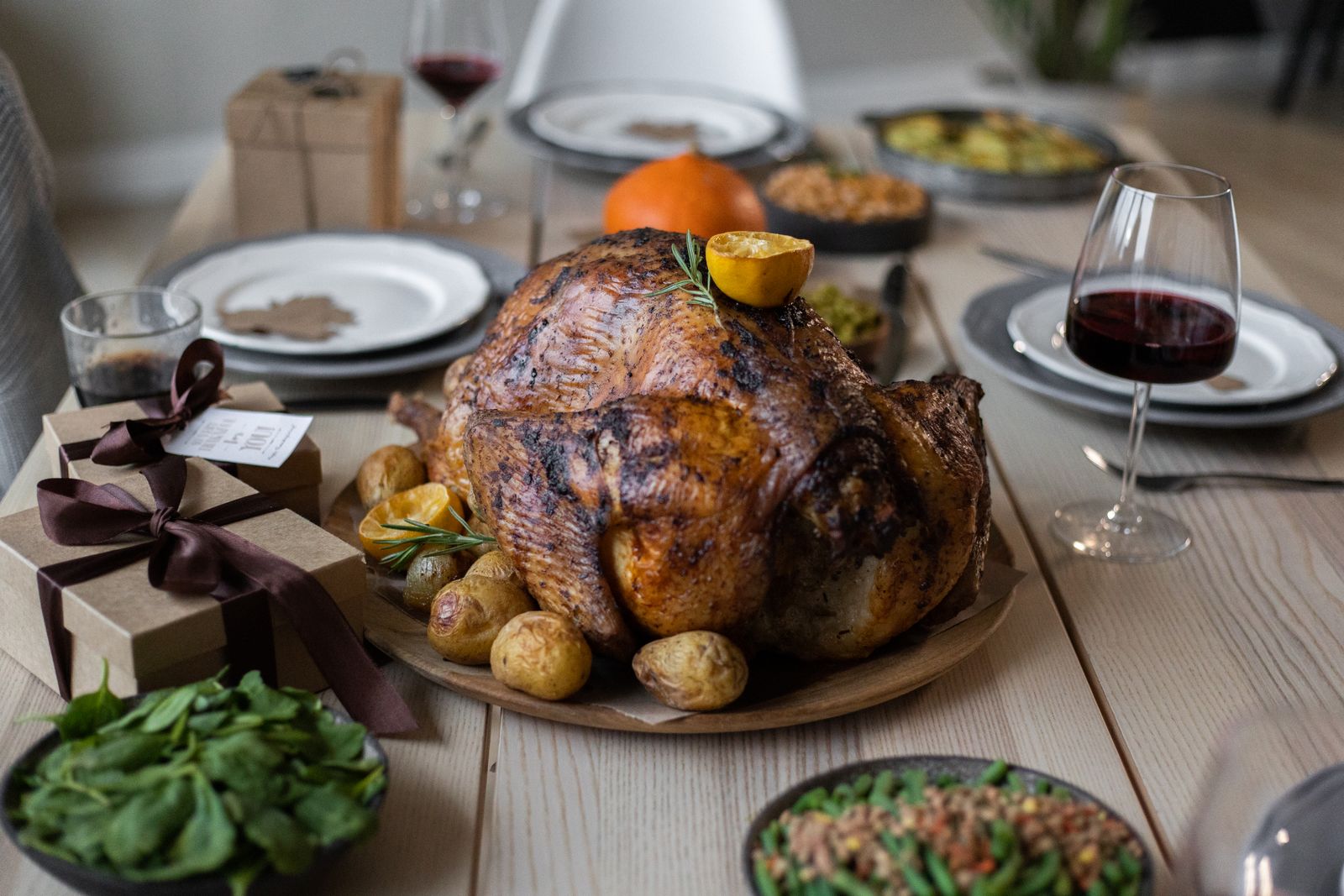 Roast turkey with potatoes on a Thanksgiving table, one of the Jacques Pepin recipes for the holidays