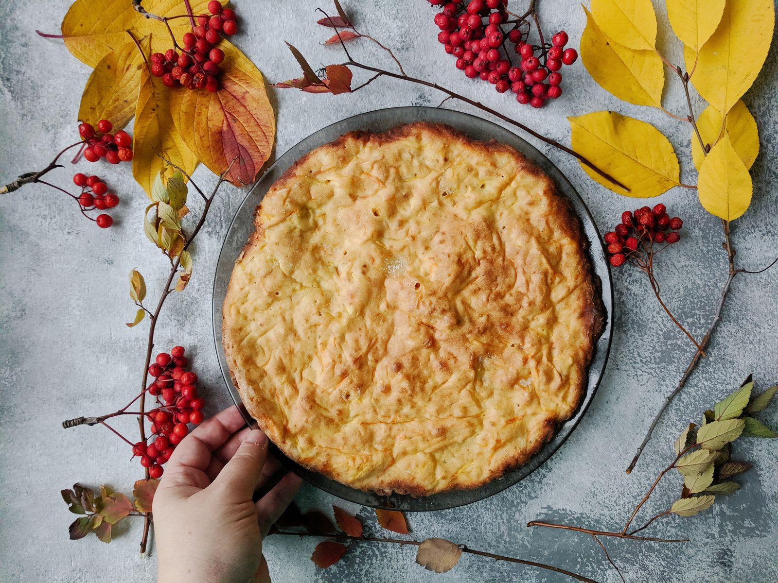 Golden potato topped beef cottage pie in a round pan, one of the classic shepherd's pie recipes