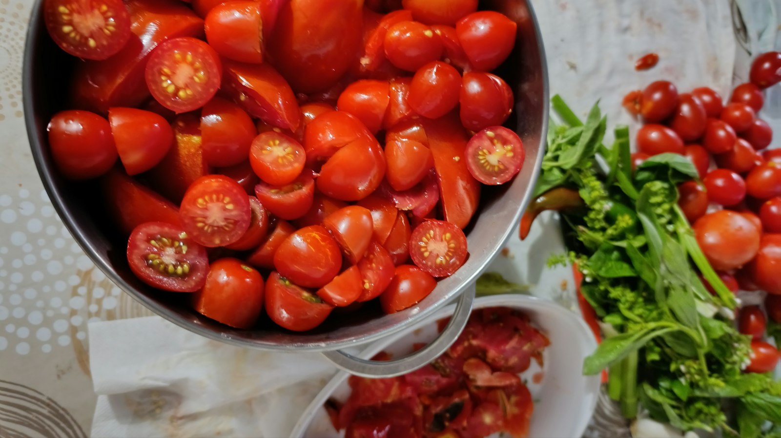 Fresh tomatoes poured from a colander for a make-ahead sauce
