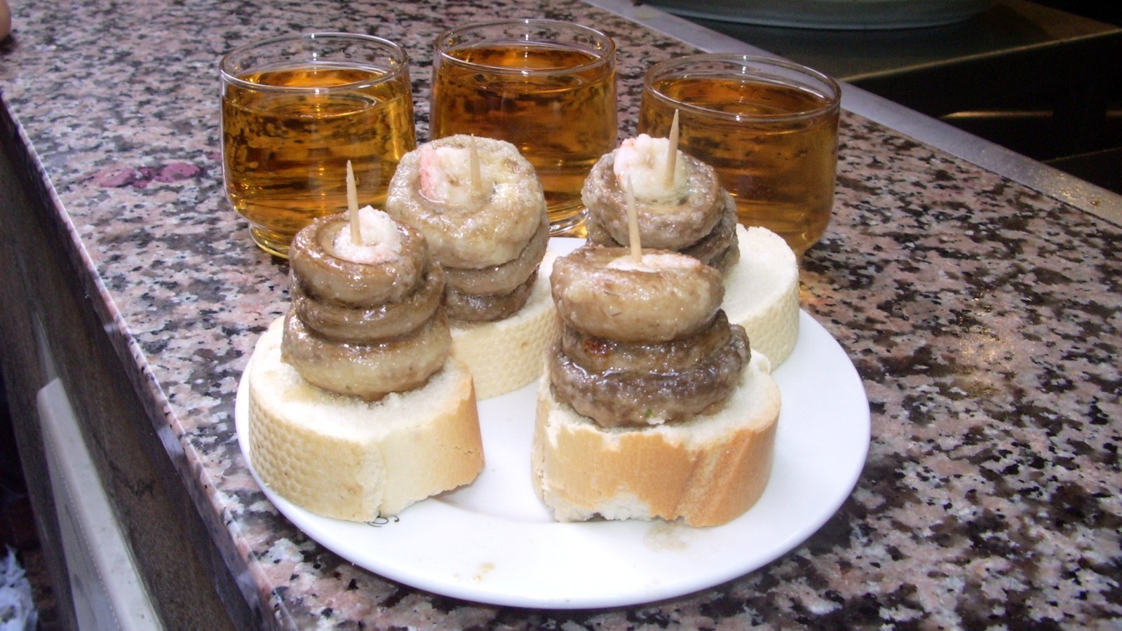 Grilled mushroom stacks on bread at a Logroño tapas bar
