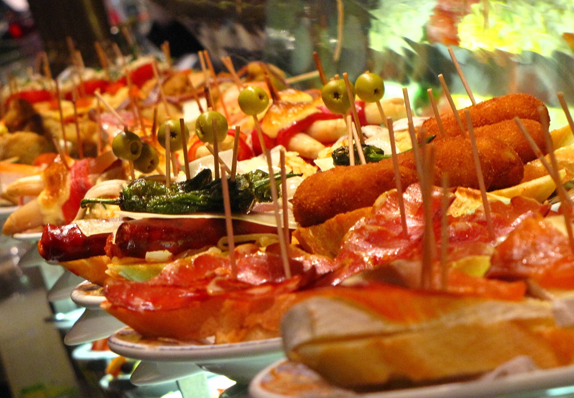 Bar counter covered with pintxos for Spanish tapas night