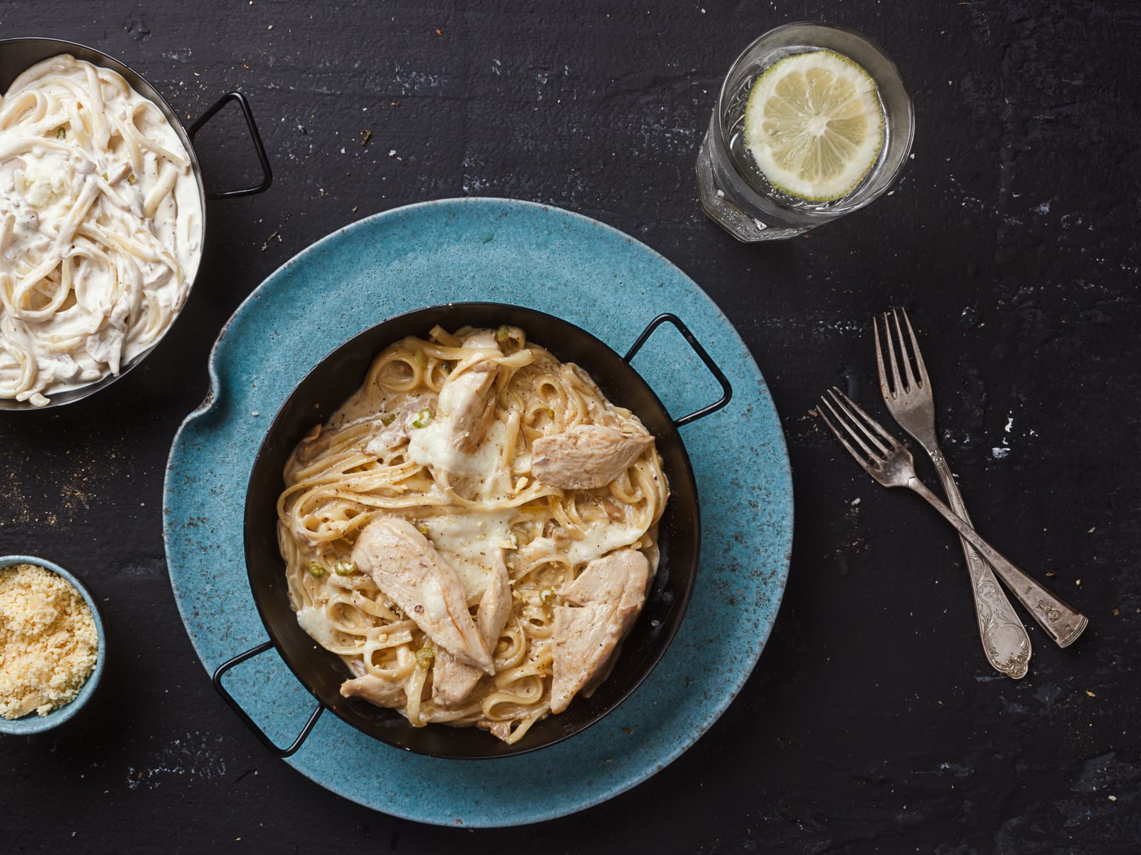 Creamy chicken pasta in a black skillet