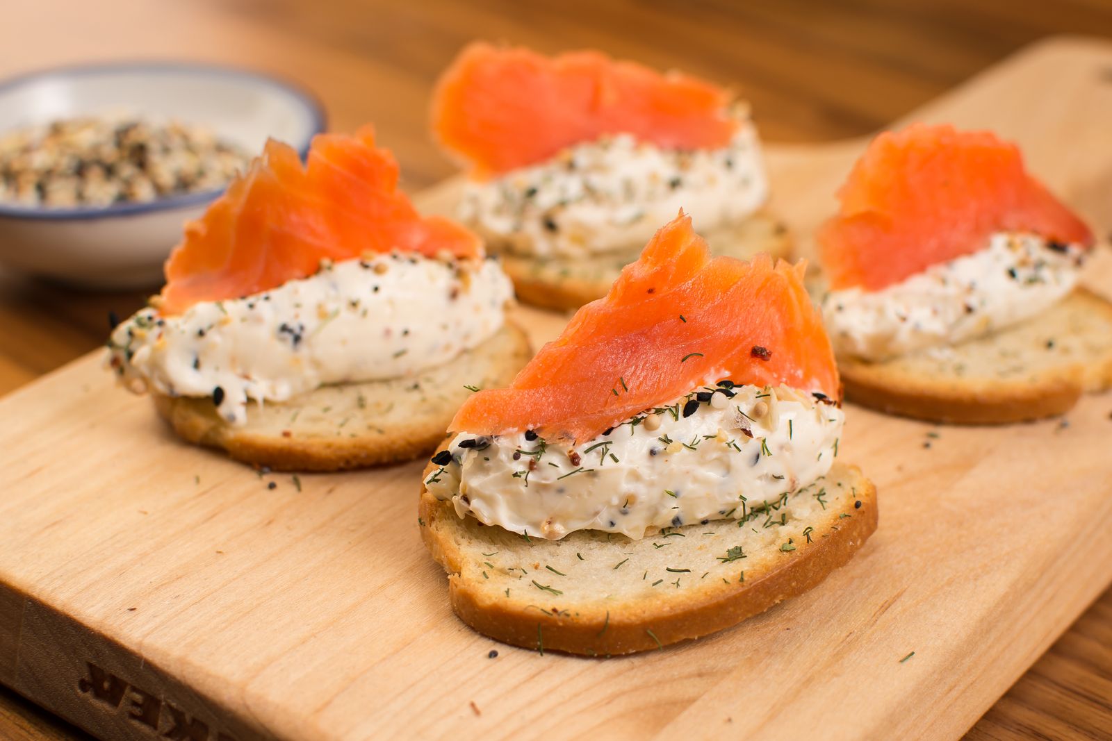 Smoked salmon and cream cheese bites on little toasts, elegant holiday party food