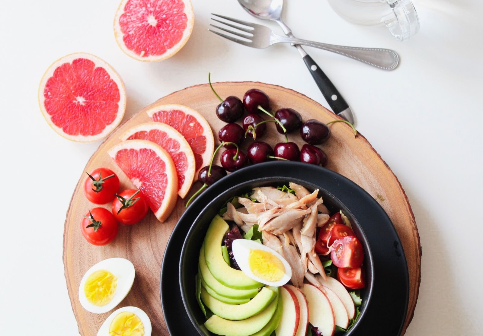 Pink grapefruit slices with avocado salad, a pretty start to holiday party food