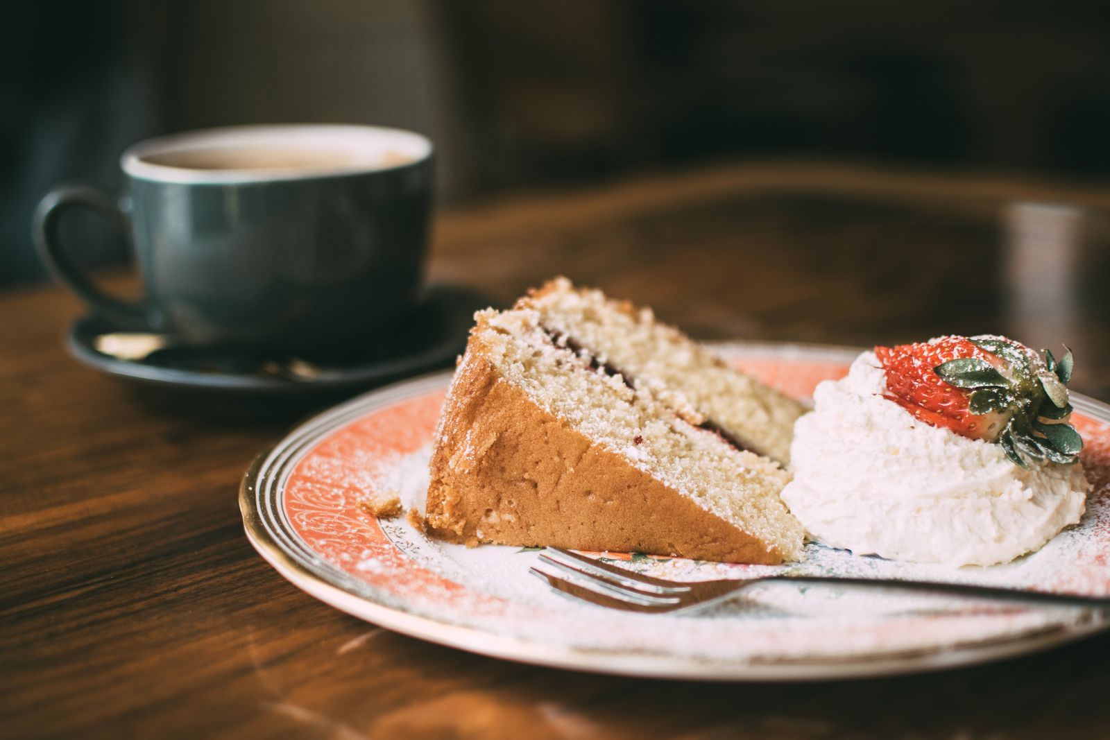 Slice of Victoria sponge with jam and cream, a Mary Berry Christmas tea favorite