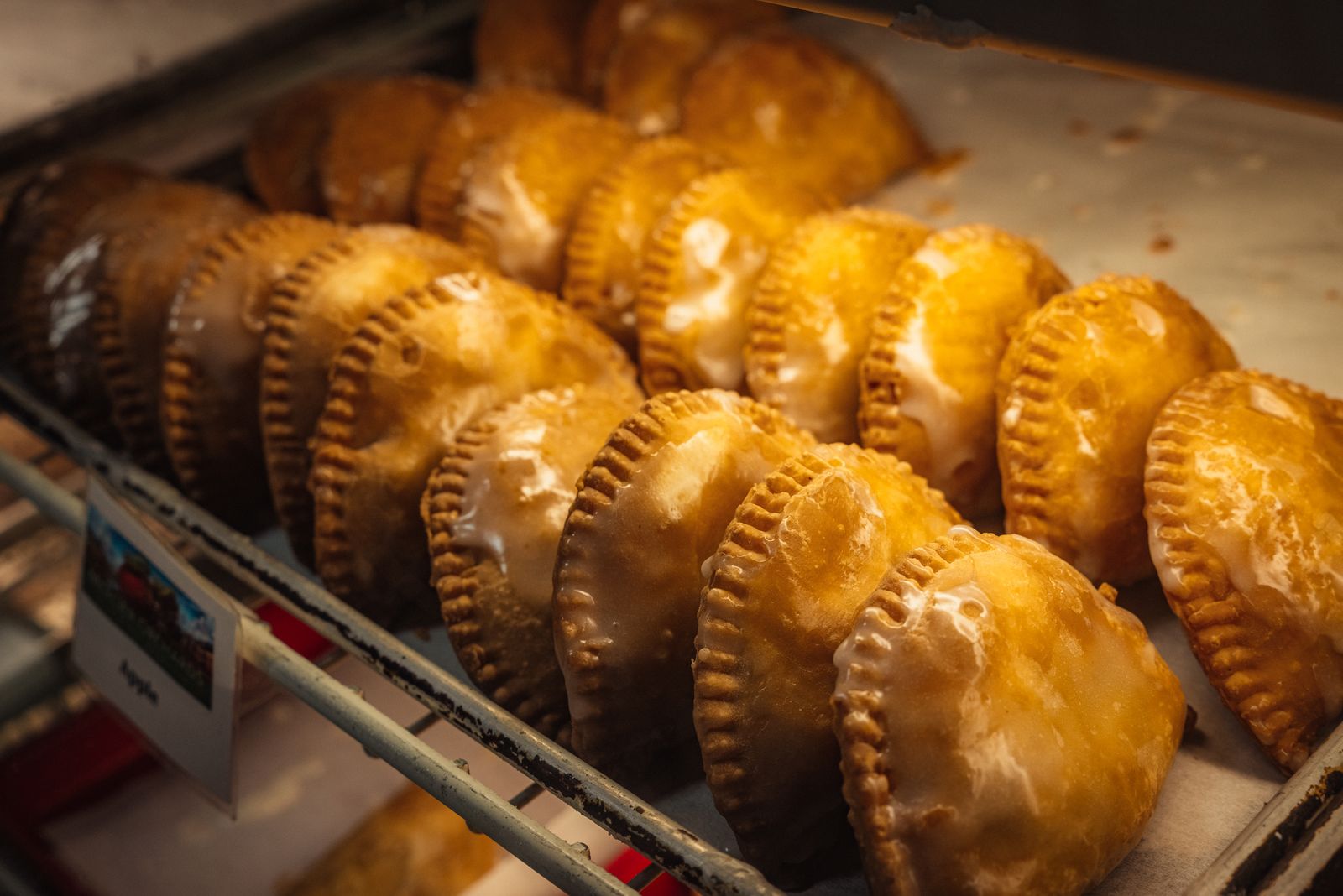Golden homemade hand pies in a bakery case