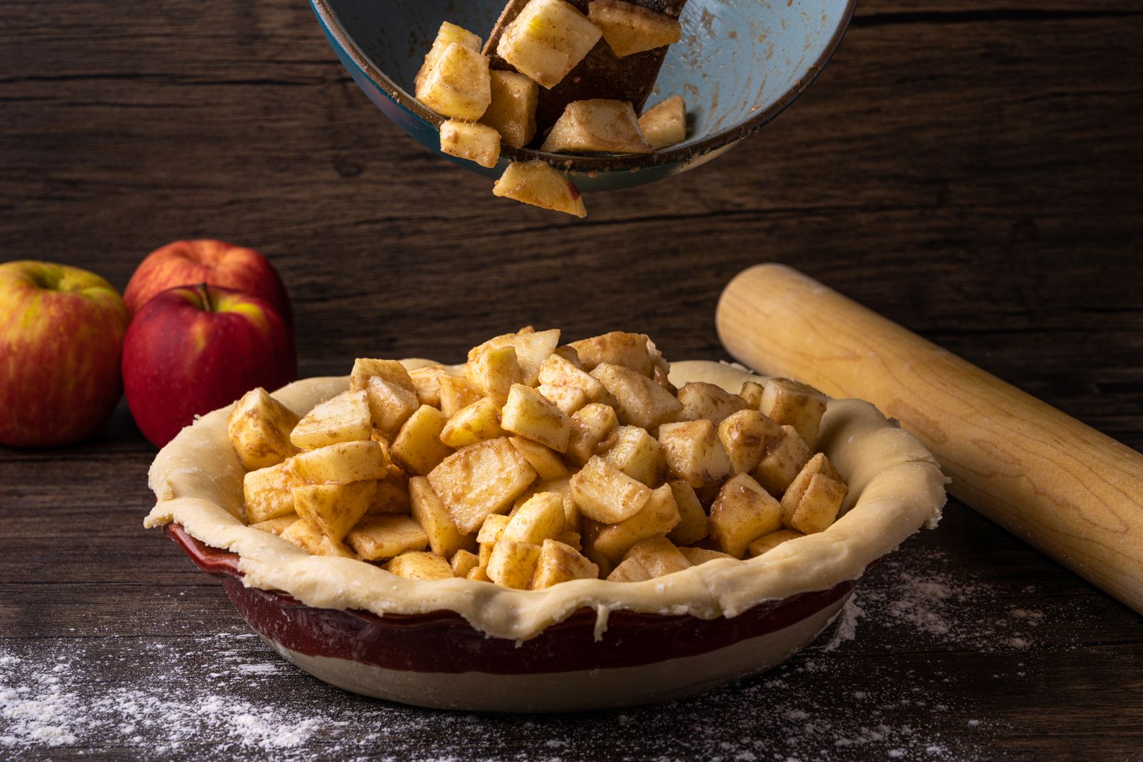 Spiced apples piled into a pie crust, ready for the top crust