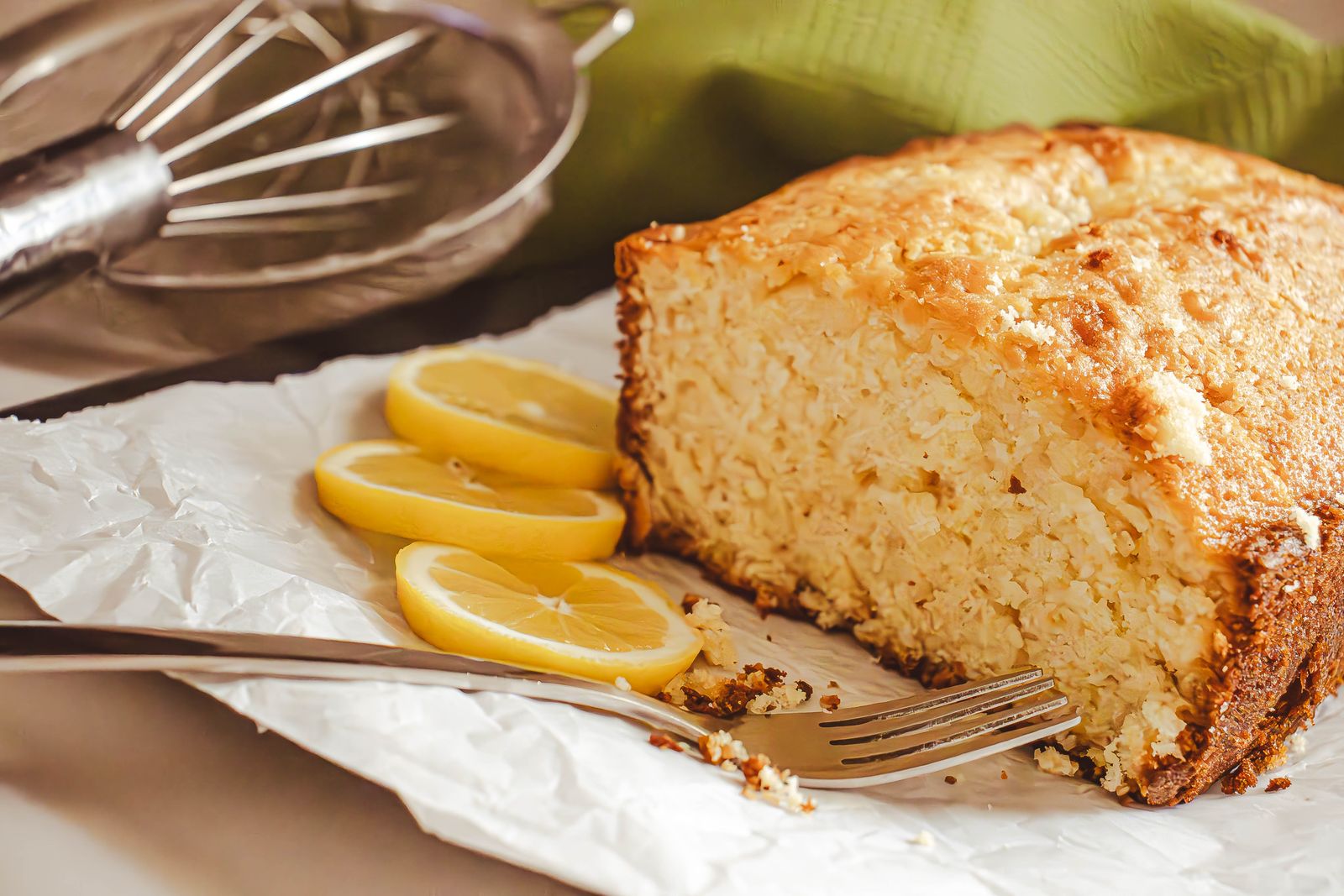 Pound cake slices with lemon on an orange plate