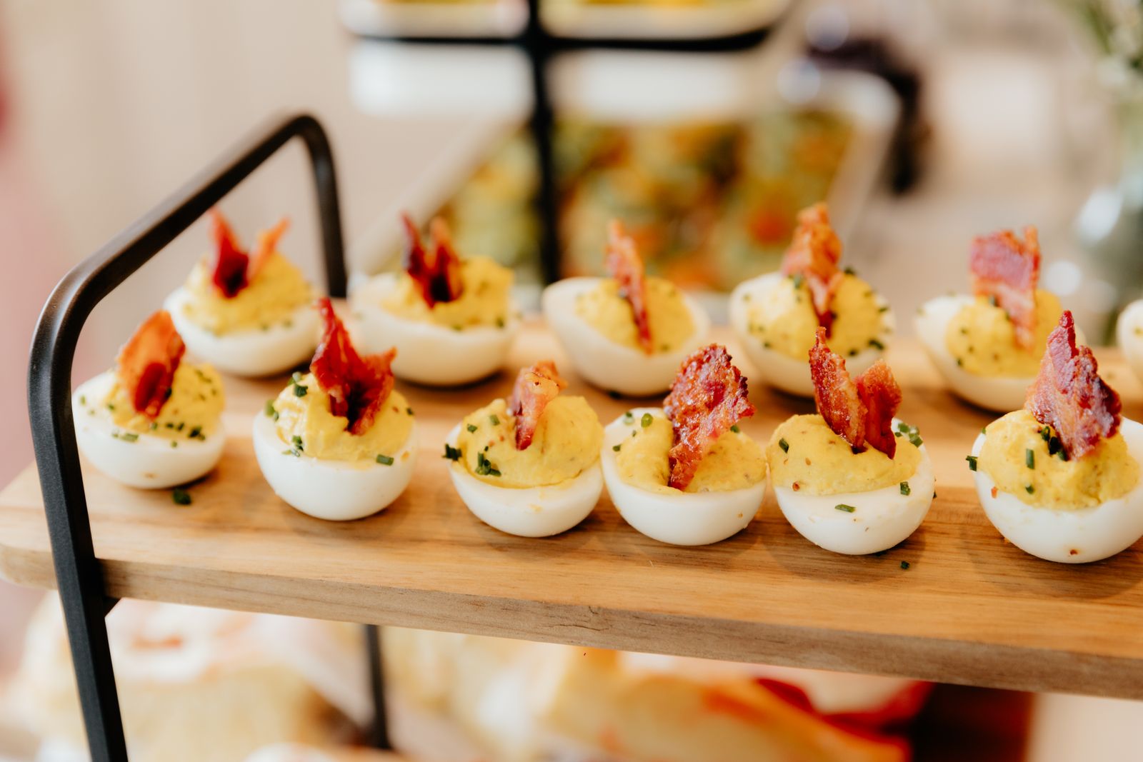Creamy yolk bites topped with crispy bacon and cheddar
