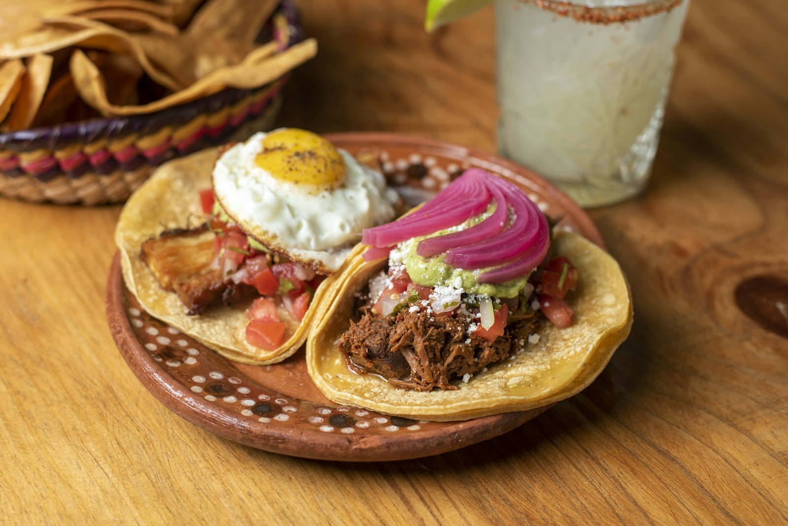 Crispy tortillas topped with fried eggs and salsa