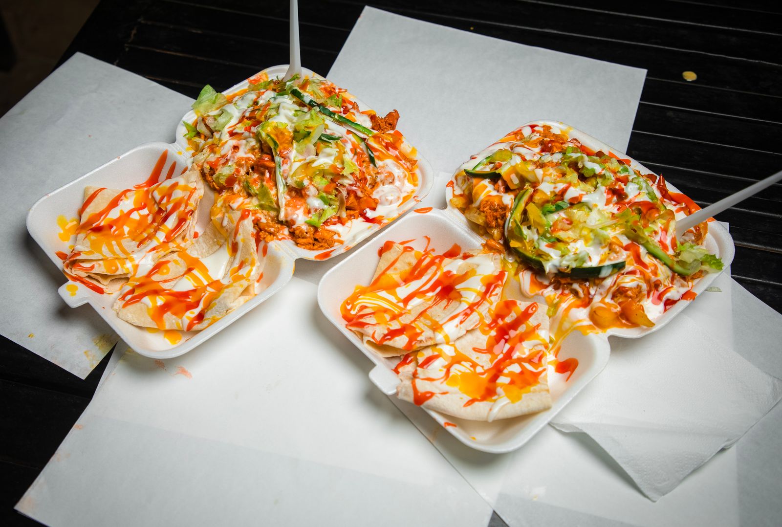 Sheet pan nachos with spicy buffalo style drizzle