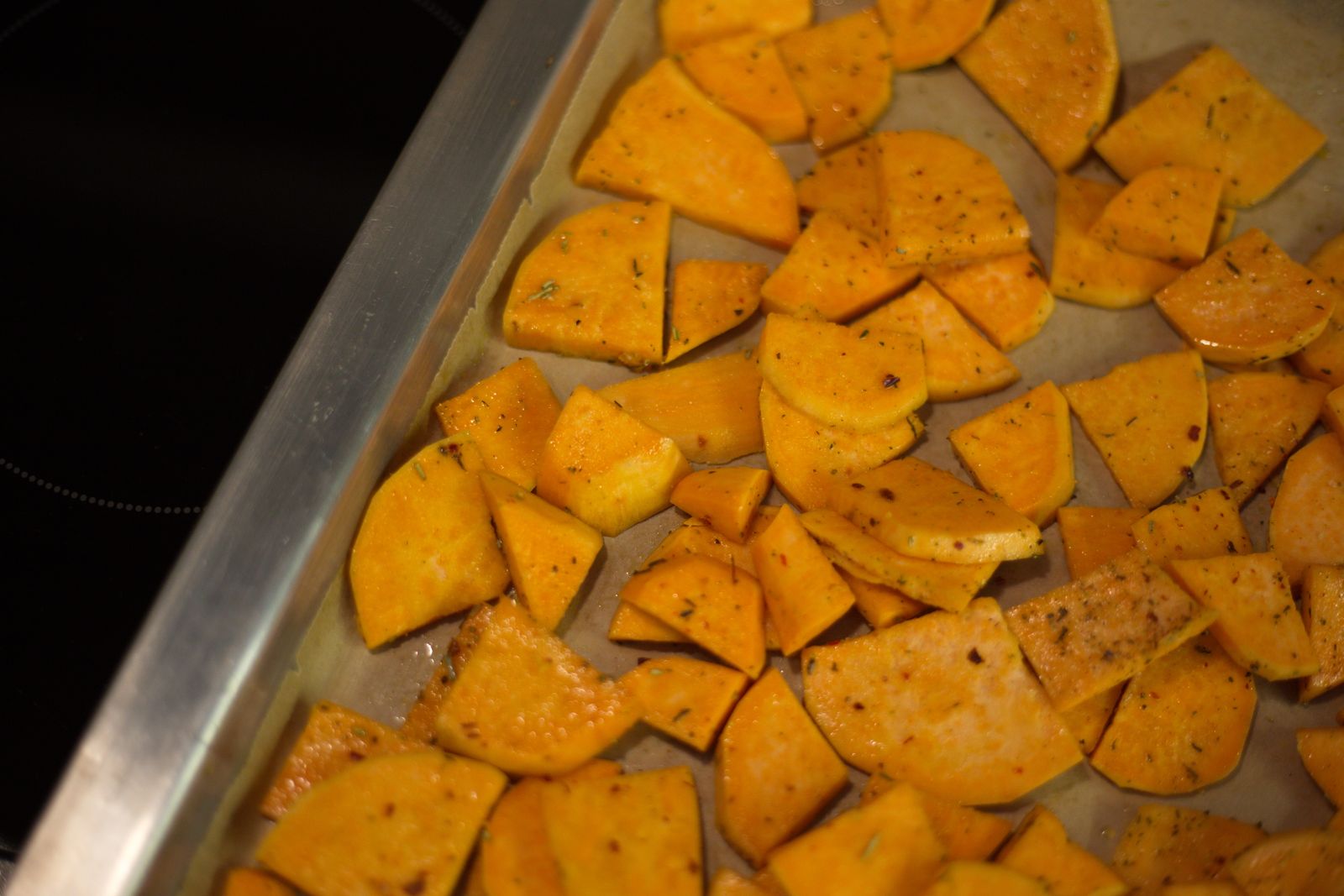 Baked sweet potato rounds on a sheet pan