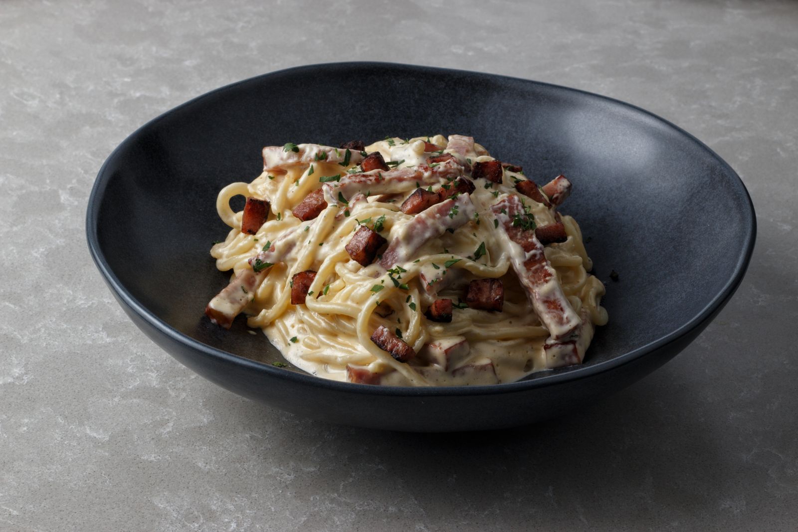 Creamy carbonara style noodles with bacon and black pepper