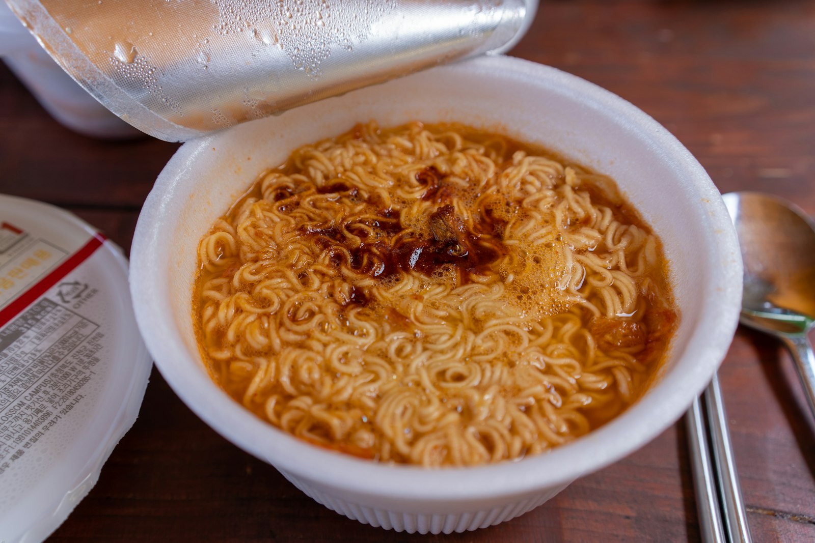 Bowl of creamy cheese ramen with green onions
