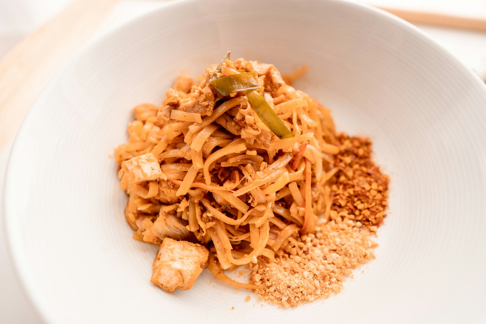 Ramen noodles tossed in peanut sauce with cucumber and chili