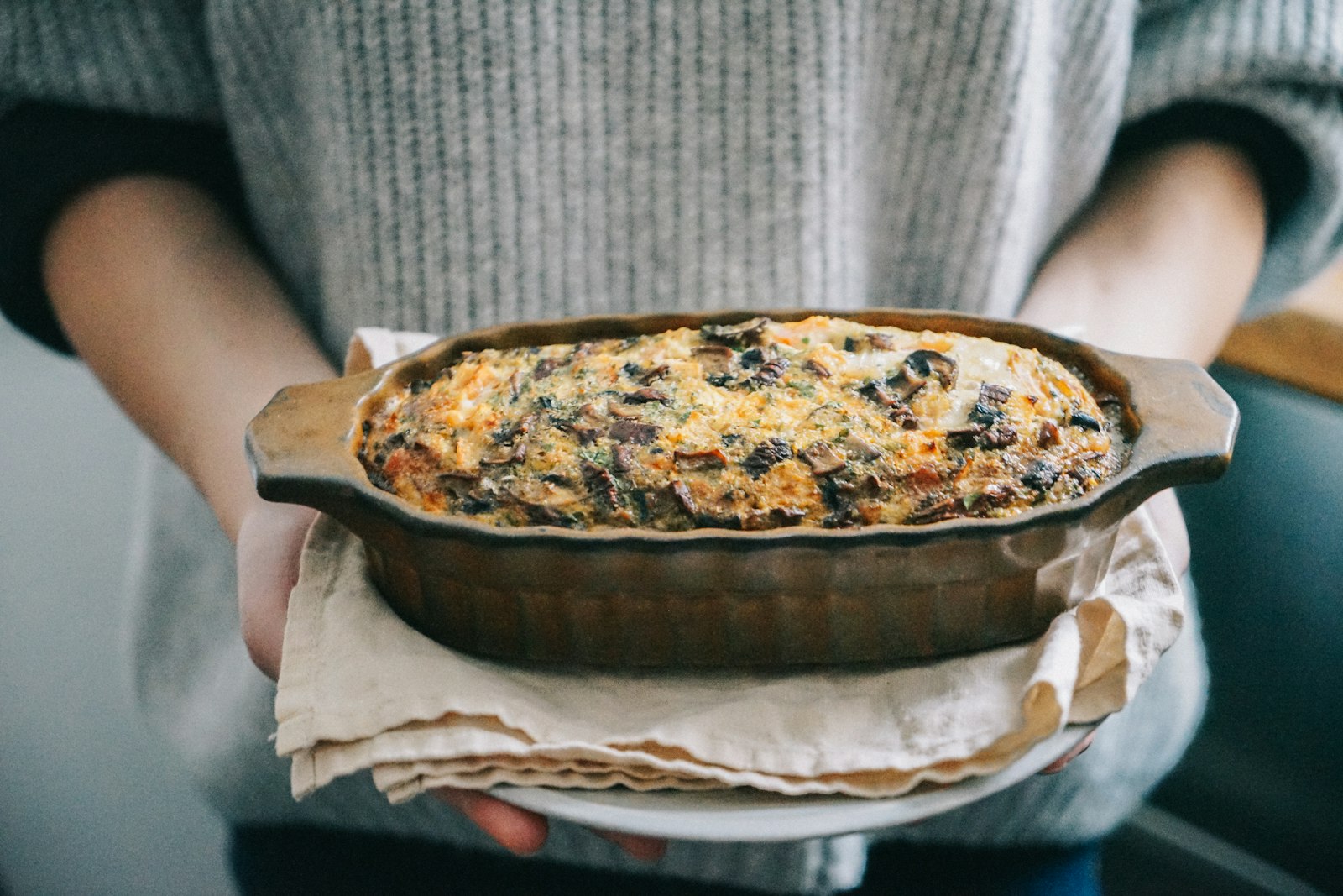 Square of breakfast egg bake with sausage, peppers and cheese