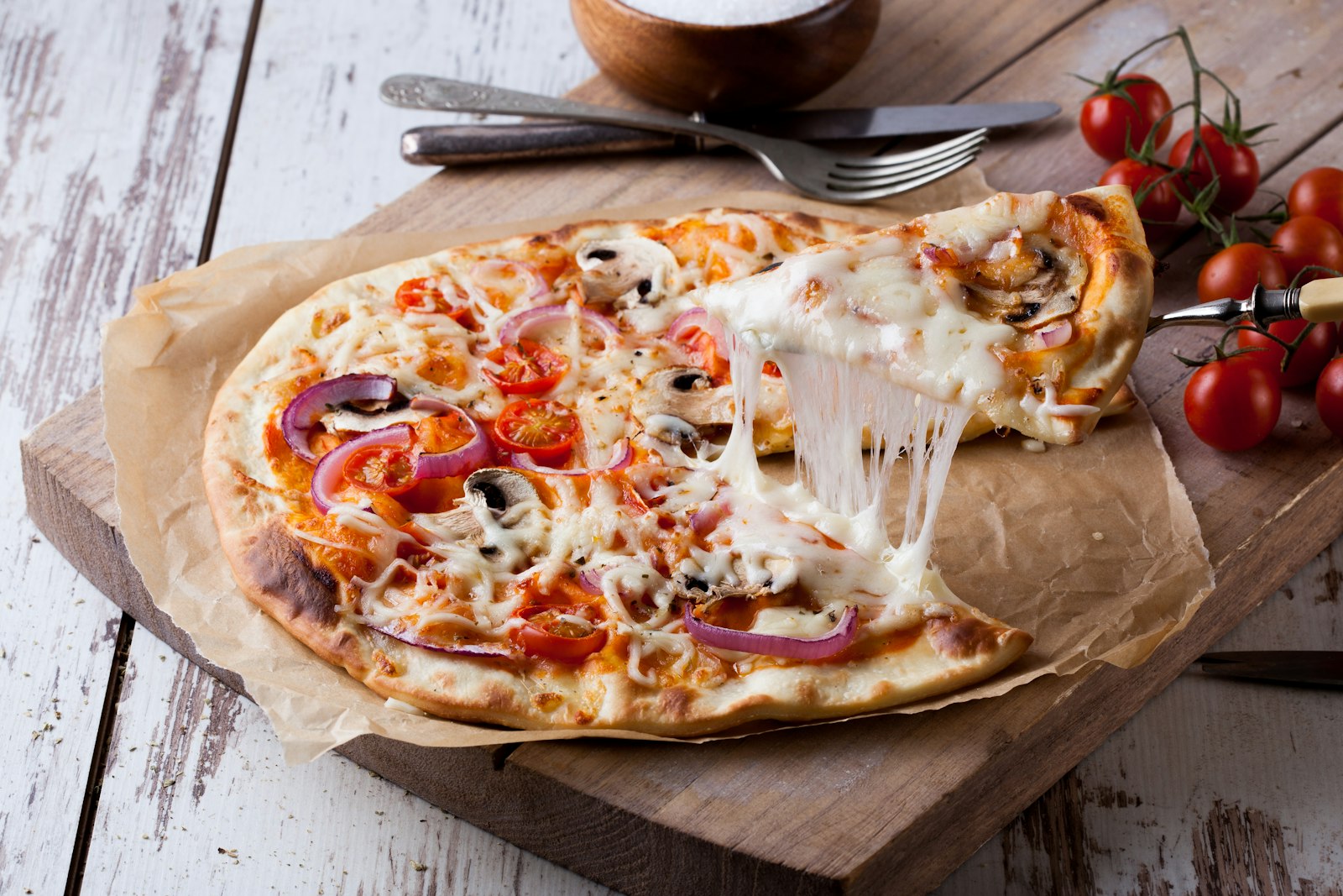 Thin crust tortilla pizza with pepperoni in a cast iron skillet