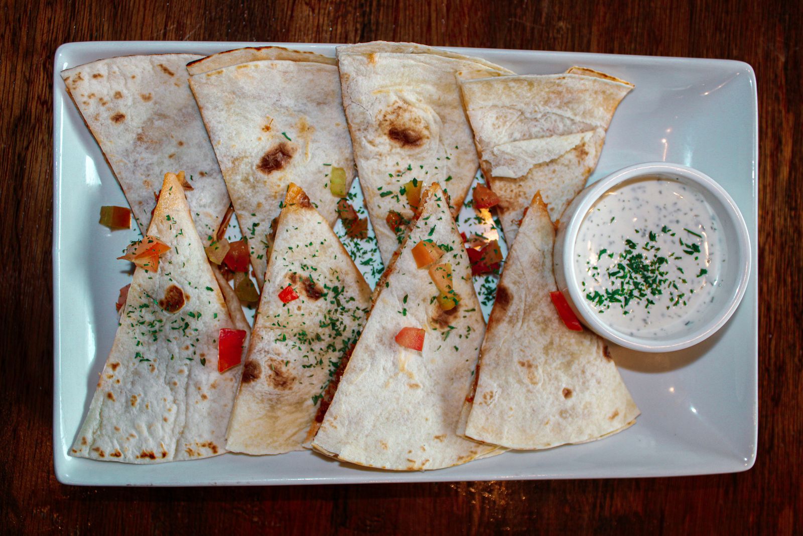 Crispy sheet pan quesadilla cut into squares