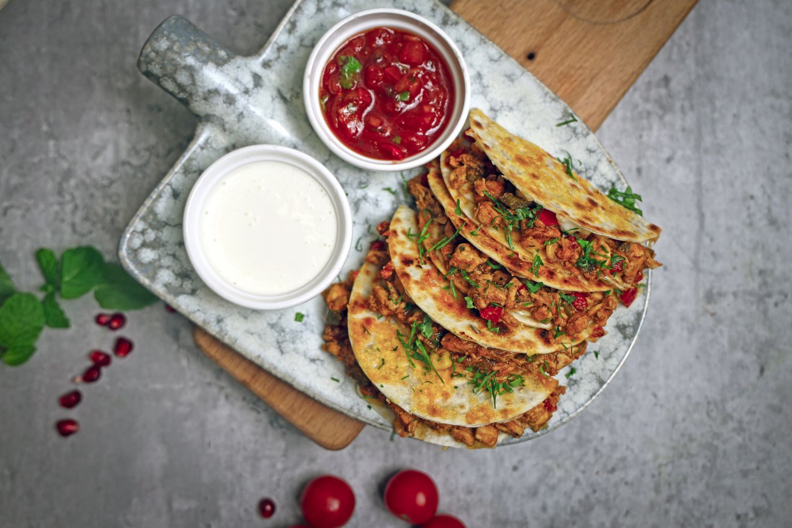 Crispy turkey and cheese quesadilla wedges with cranberry sauce