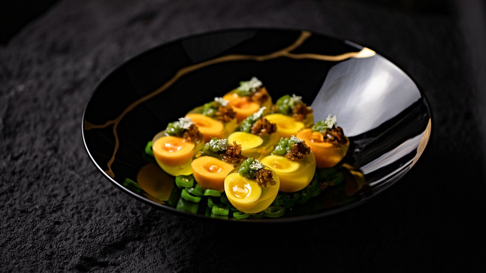 Deviled eggs with fresh greens on a plate
