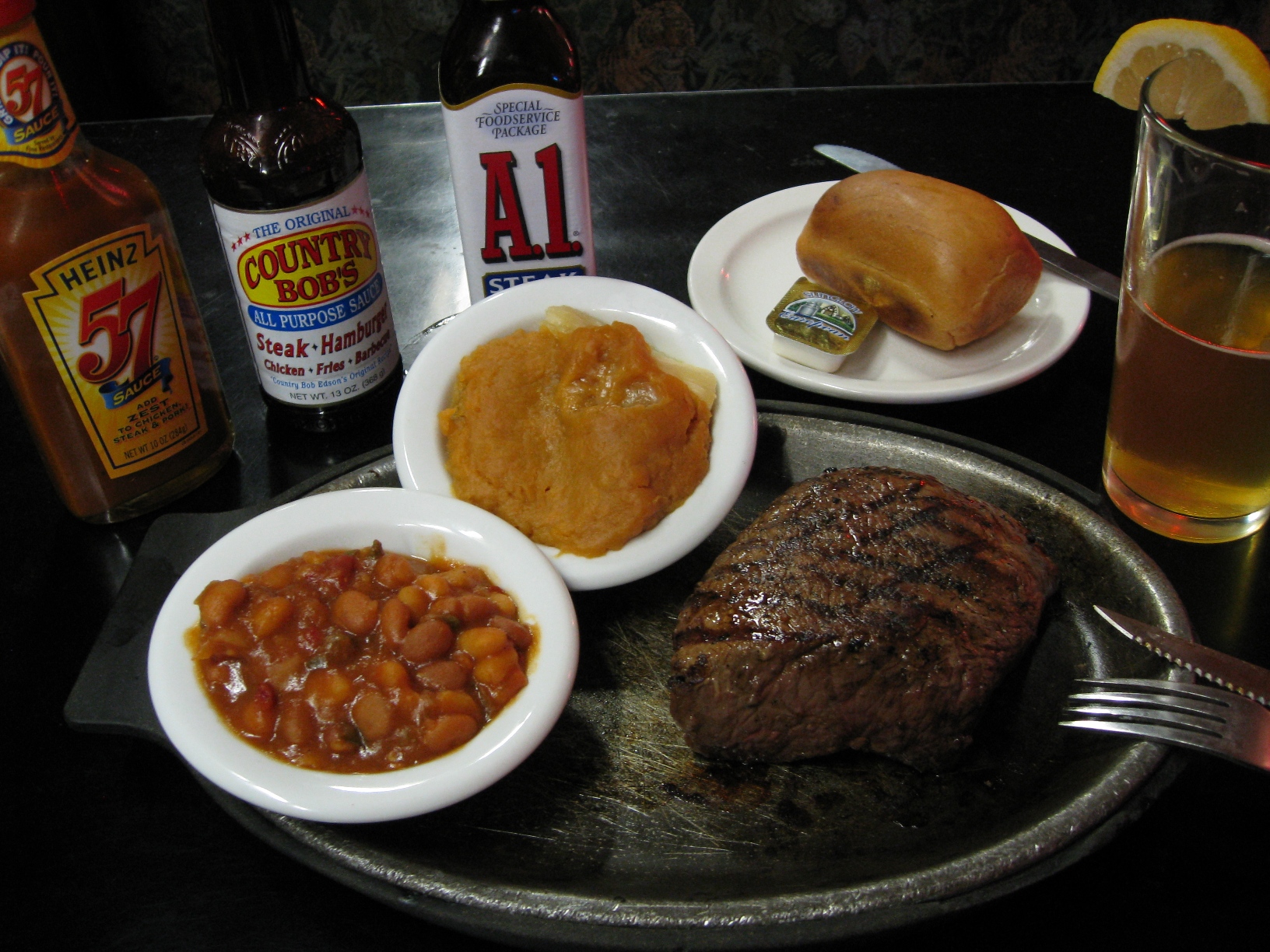 A chuck wagon style side next to a steak dinner
