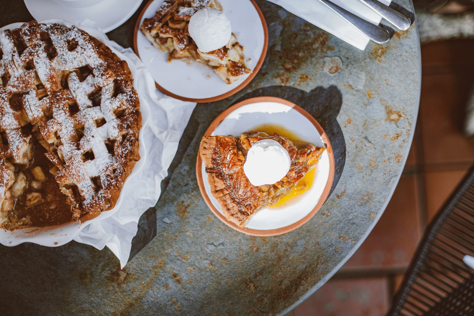 Slices of fruit pie with cheese on the side