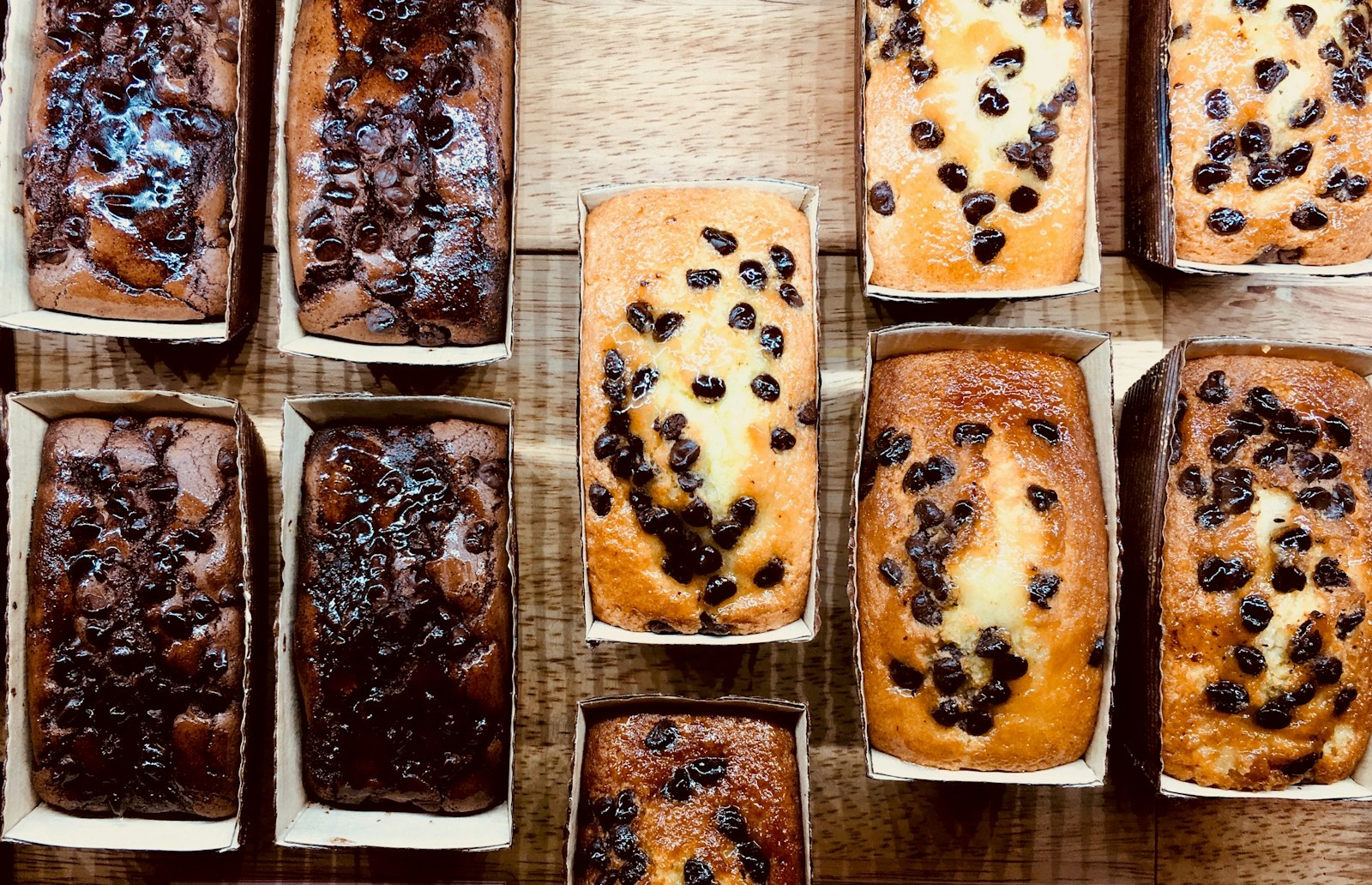 Rows of mini loaf breads baked in paper loaf pans for holiday gifts