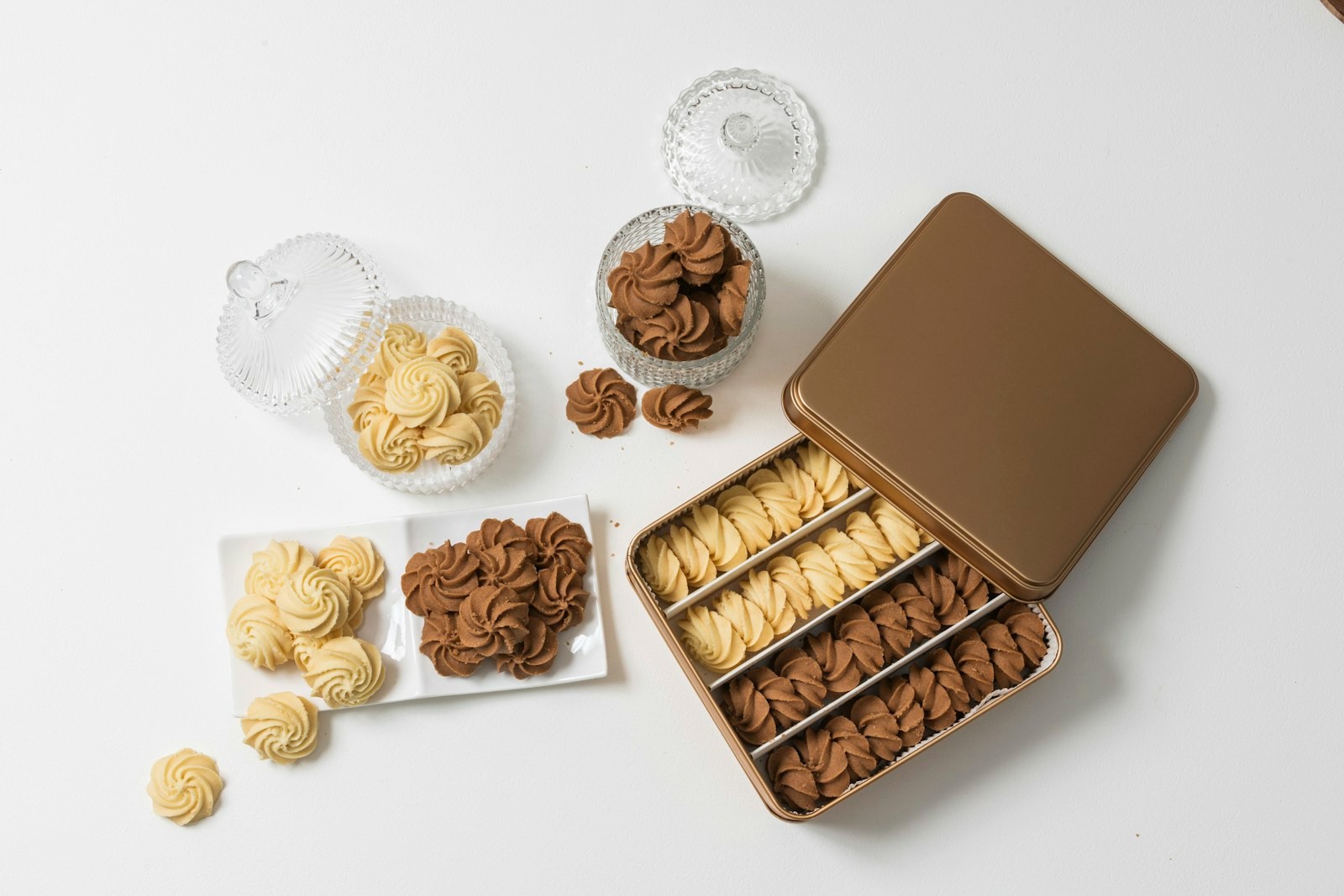 Vanilla and chocolate swirl butter cookies packed in a plain gold metal tin