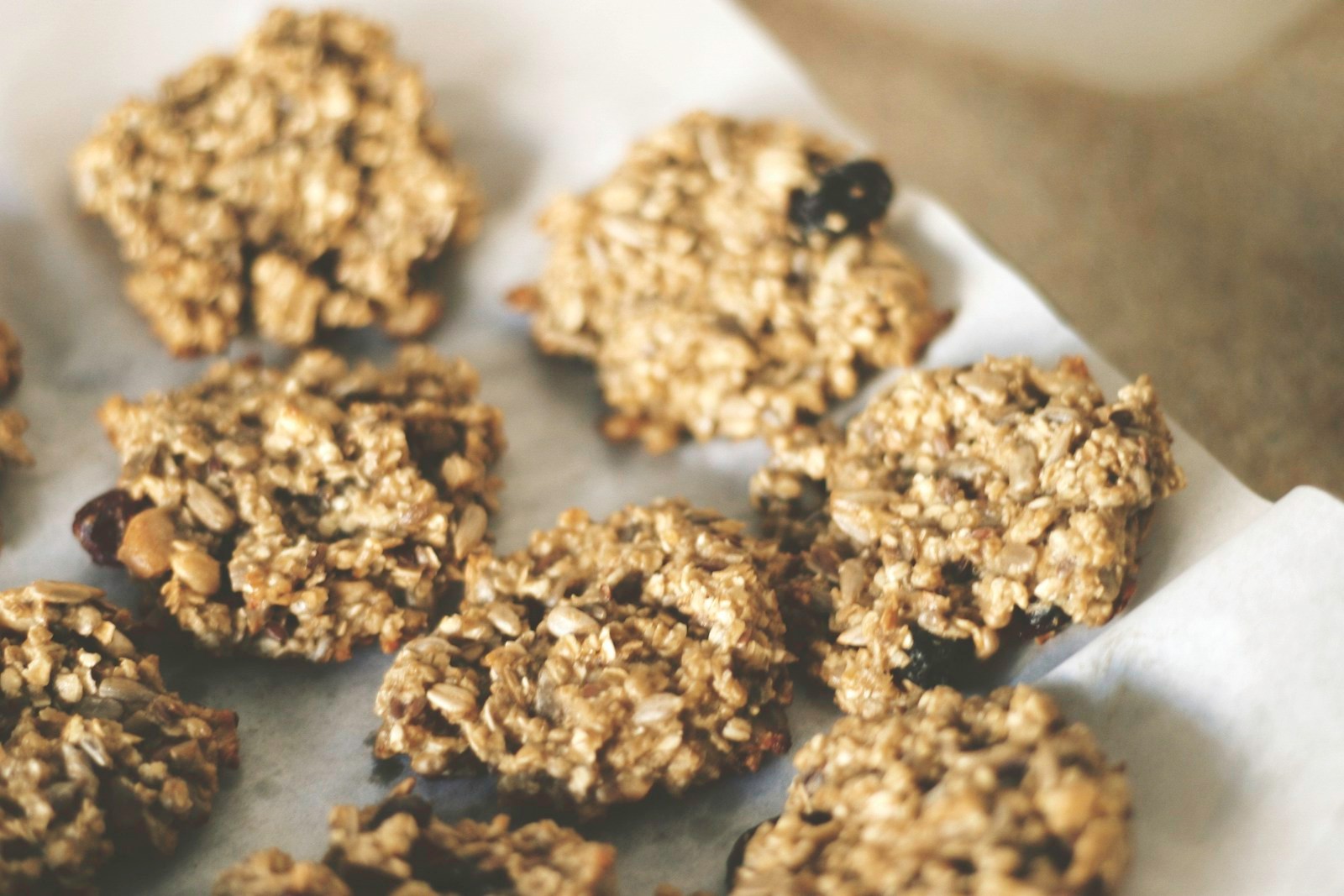 Banana oat flourless cookies with chocolate chips on parchment