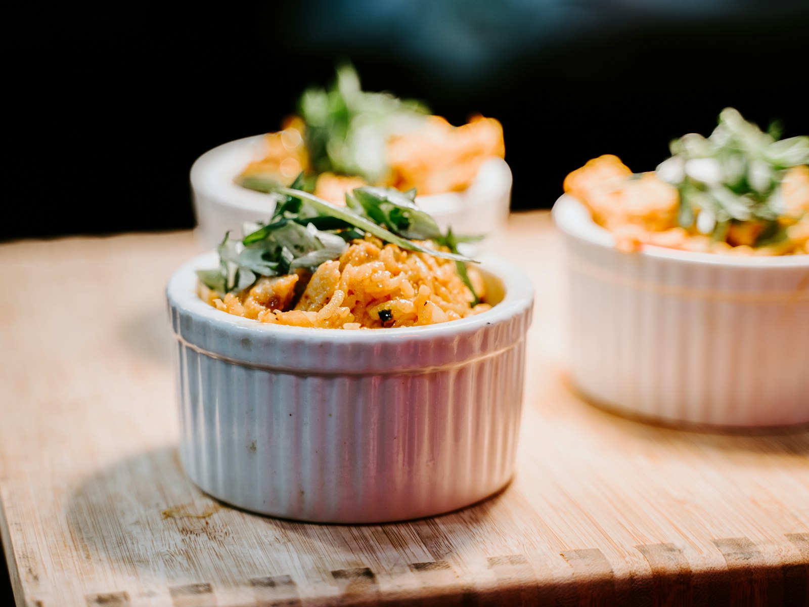 A creamy noodle bake in a white bowl