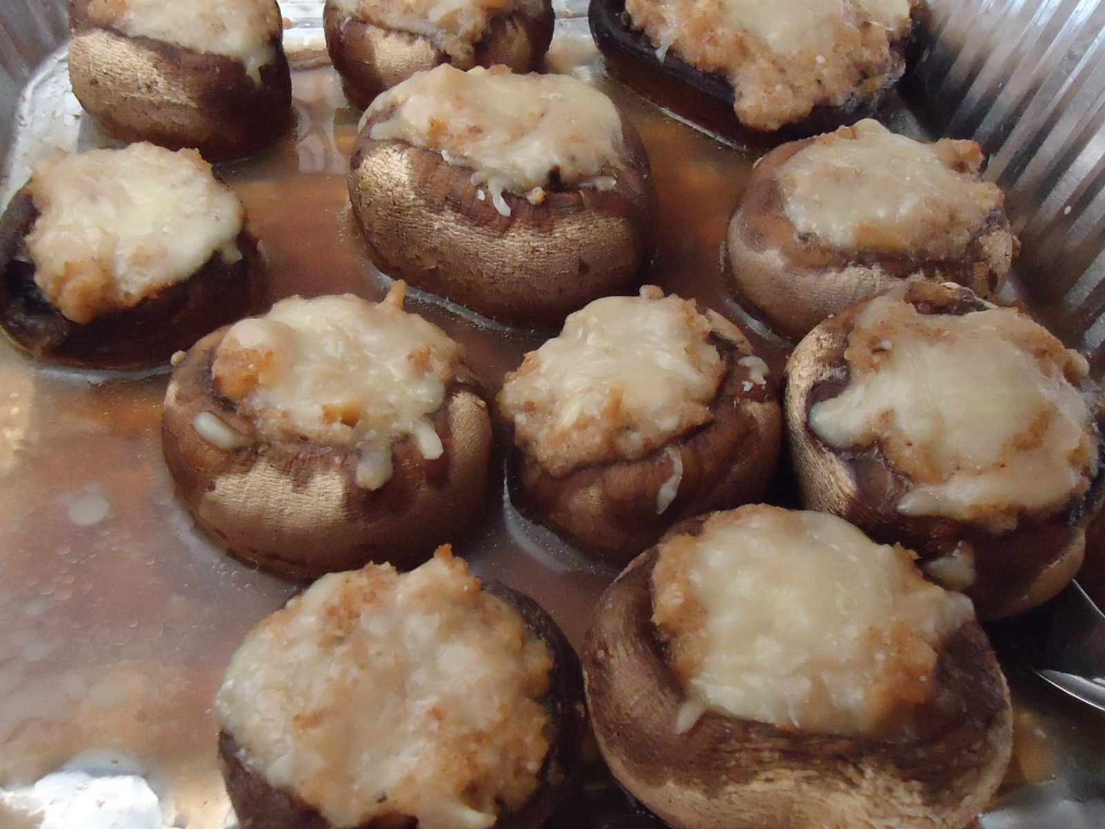 Party appetizer tray of sausage and cheese stuffed mushrooms