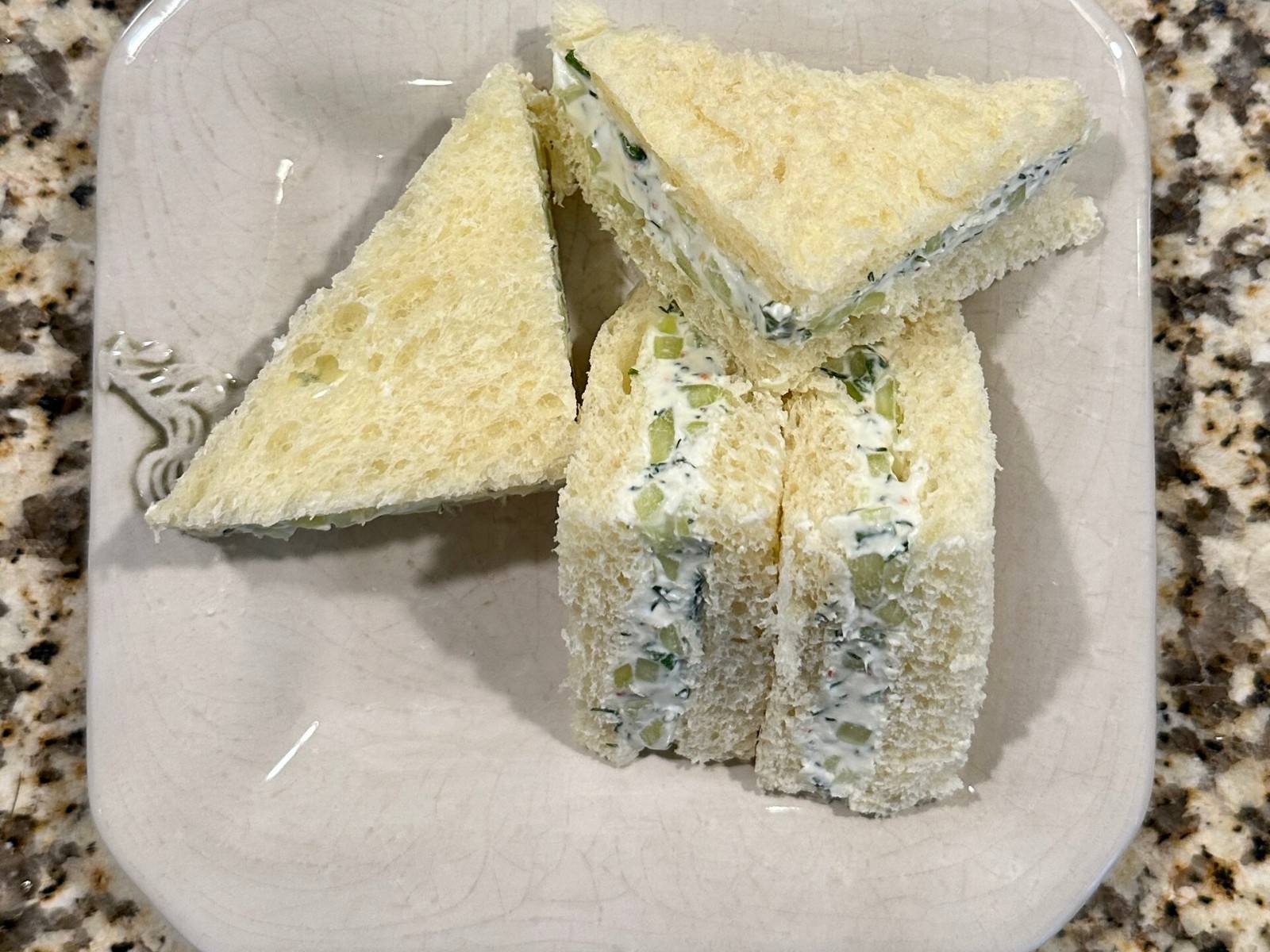 Benedictine cucumber tea sandwiches cut into neat triangles and fingers