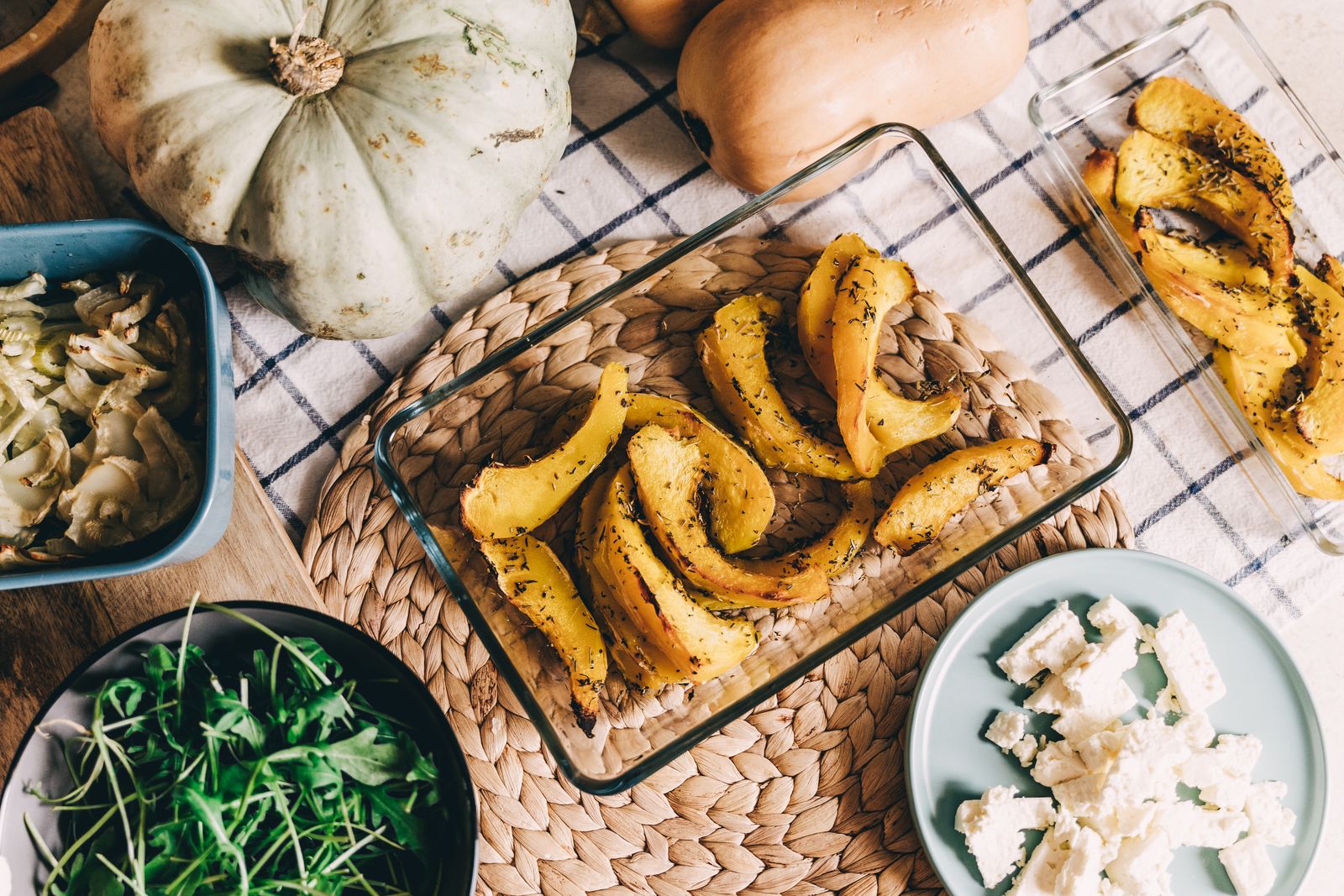 Roasted butternut squash slices in a baking dish