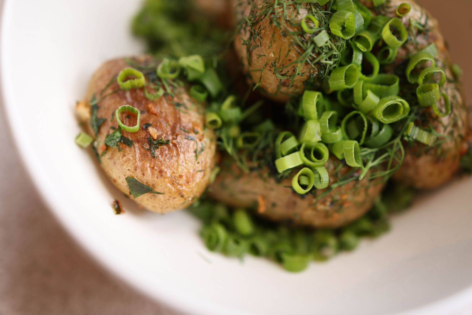 Ranch smashed potatoes topped with dill and green onions