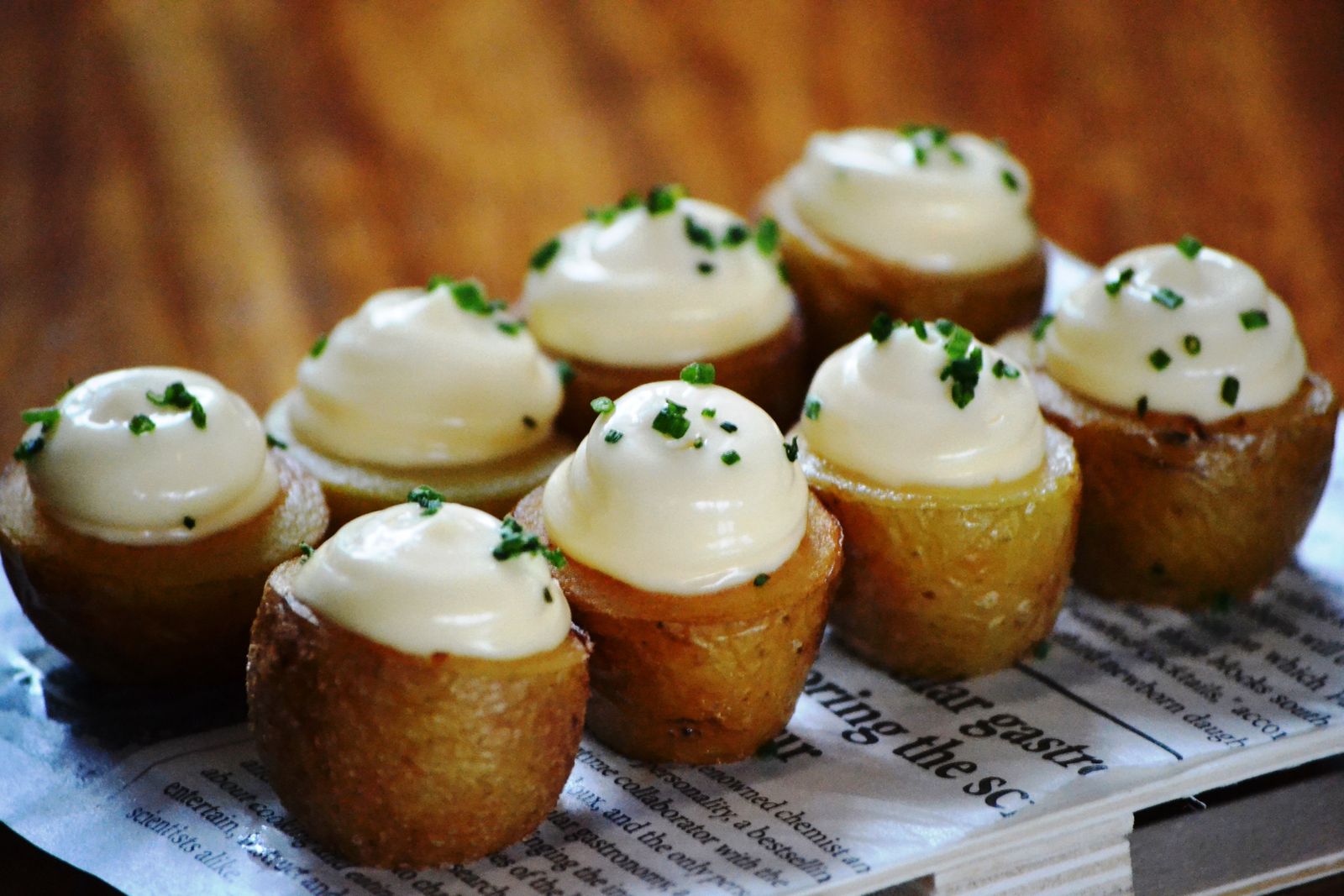 Smashed potatoes topped with dollops of sour cream
